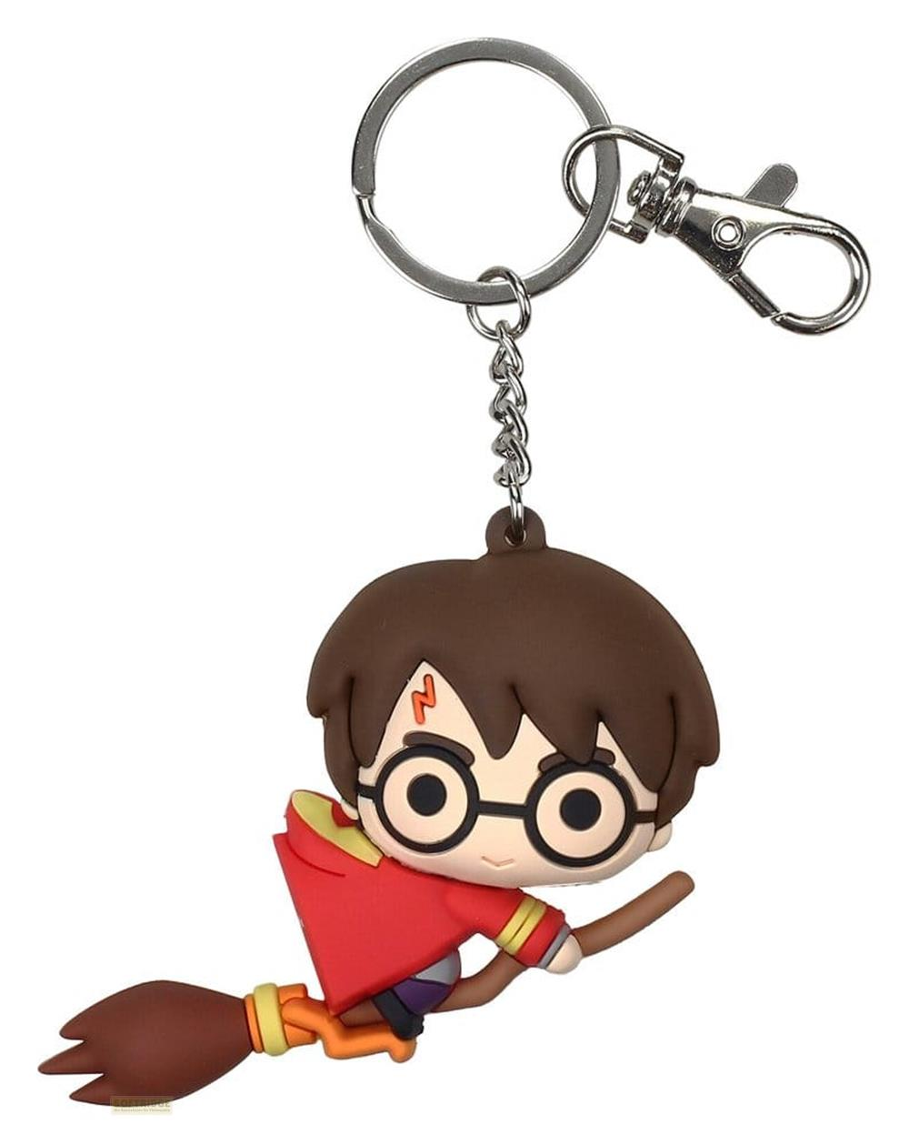 Llavero de Harry Potter en una escoba con gafas redondas y cicatriz de rayo sobre fondo blanco.
