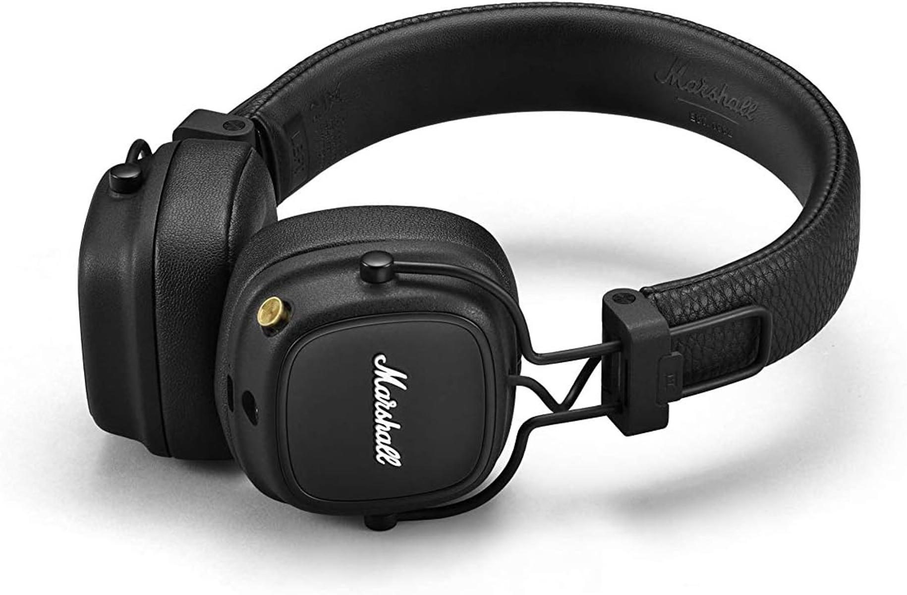 Cuffie on-ear Marshall nere con manopola di controllo dorata su sfondo bianco.