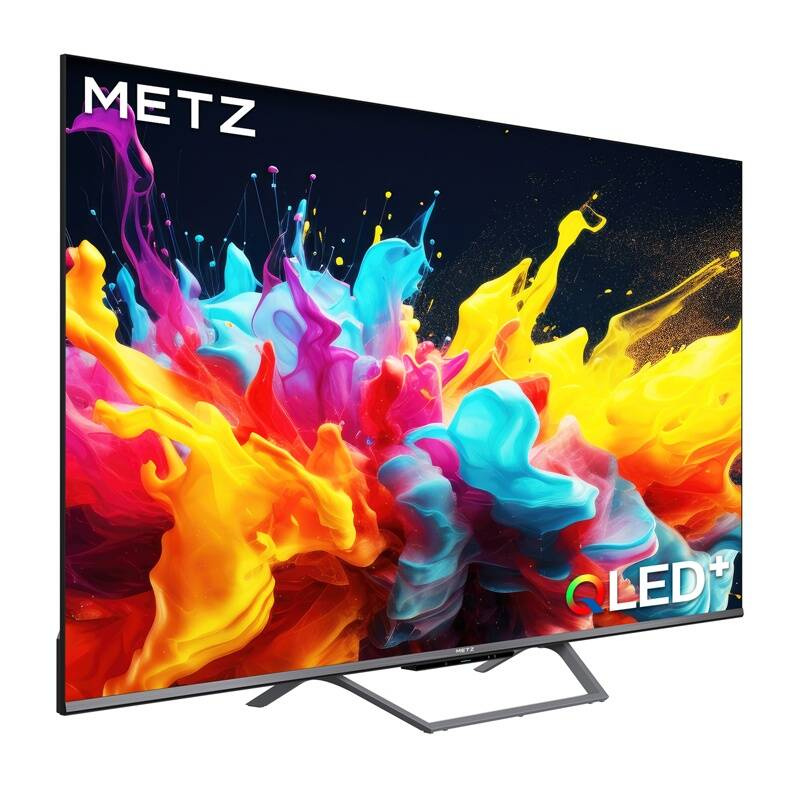 Una moderna TV Metz QLED+ mostra vivaci schizzi di colore astratti su sfondo scuro, con supporto in metallo.