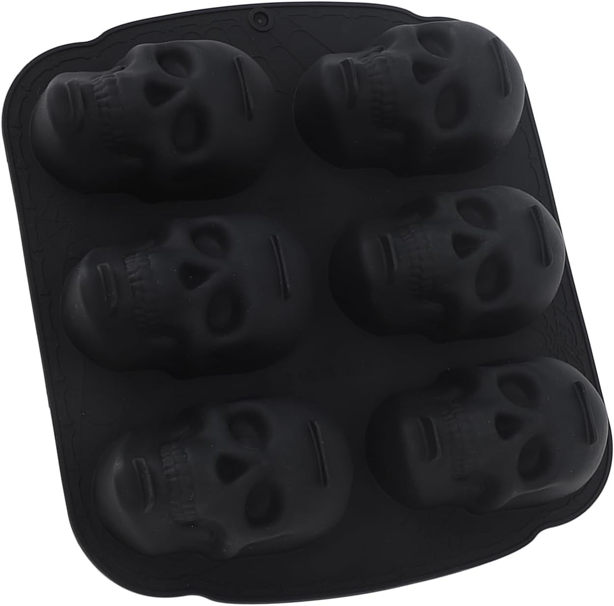 Eine schwarze Silikonform mit sechs detaillierten Totenkopf-Mulden auf weißem Hintergrund.