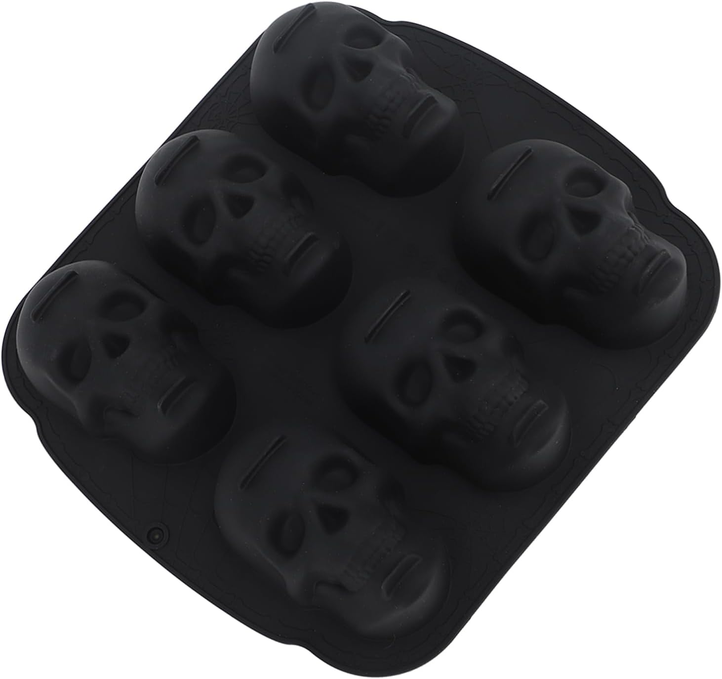 Eine schwarze Silikonform mit sechs detaillierten Totenkopf-Mulden auf weißem Hintergrund.