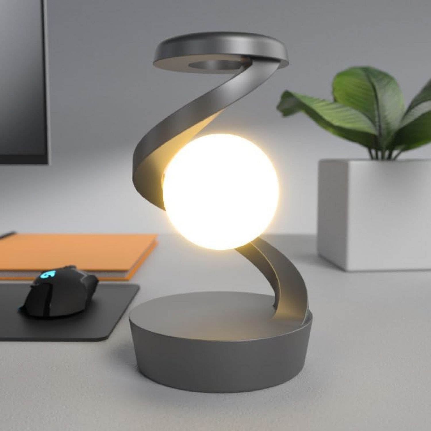 Eine moderne schwarze Schreibtischlampe mit einer schwebenden, leuchtenden Kugel in der Mitte.