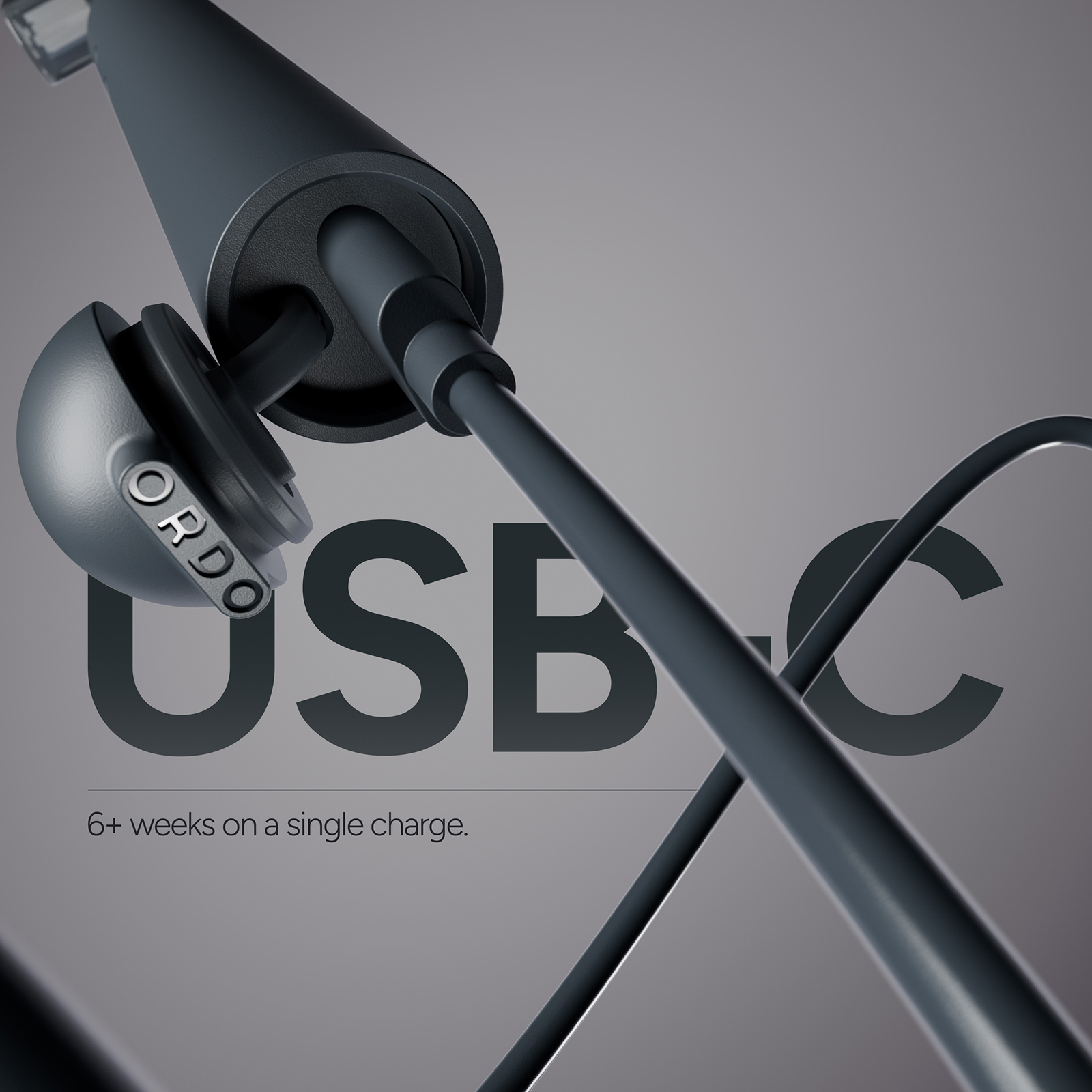 Primer plano de auriculares USB-C gris oscuro con estuche de carga.