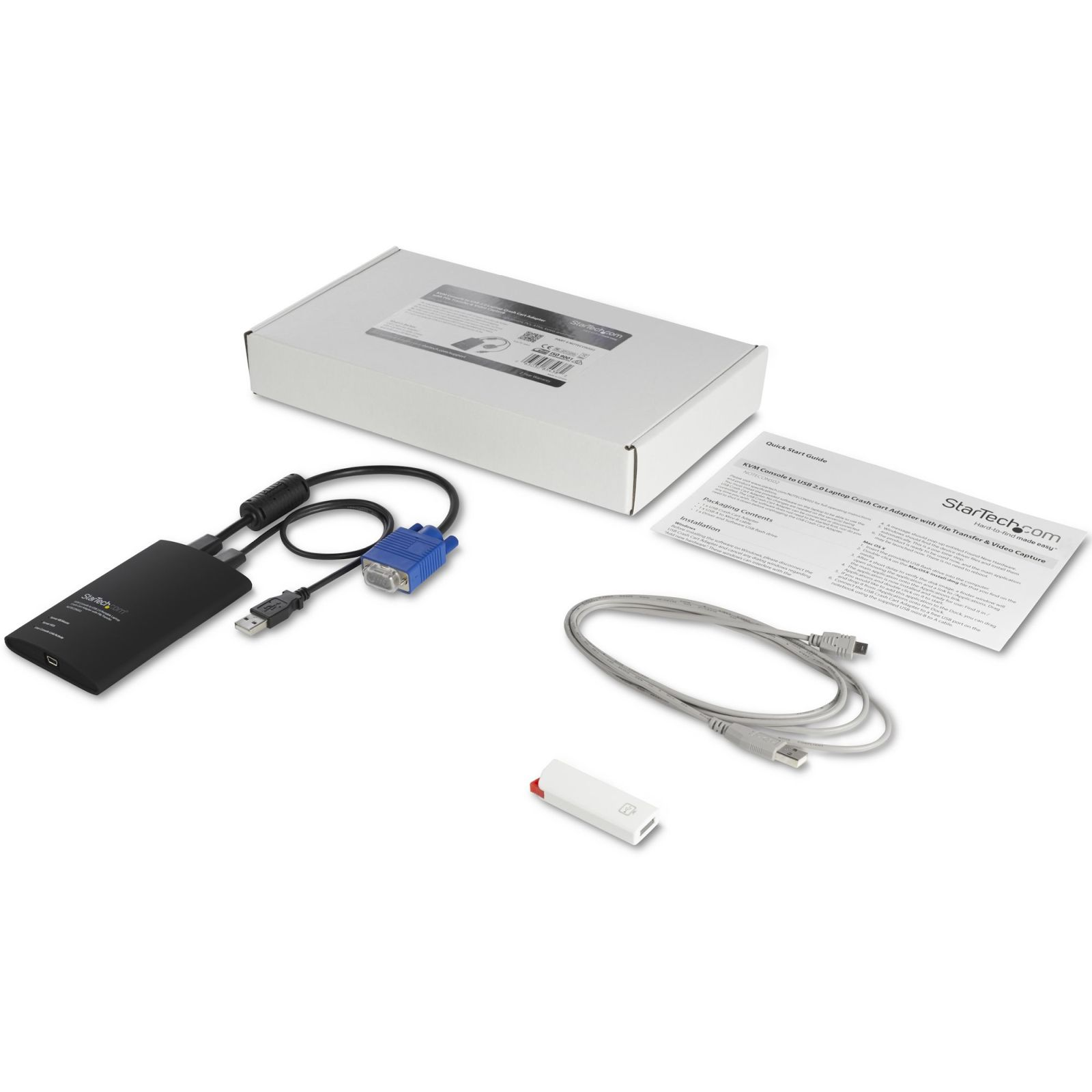 Ein KVM-Adapter mit weißem Karton, Kabeln, Handbuch und USB-Stick auf einer weißen Oberfläche.
