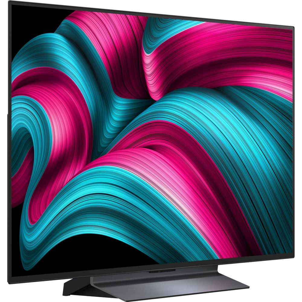 Moderne schwarze TV-Einheit mit einem farbenfrohen, abstrakten pink-türkisen Wellenmuster auf dem Bildschirm.