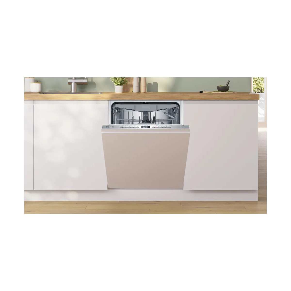 Una lavastoviglie Bosch beige semi-integrata è incassata in una cucina bianca con piano di lavoro in legno.