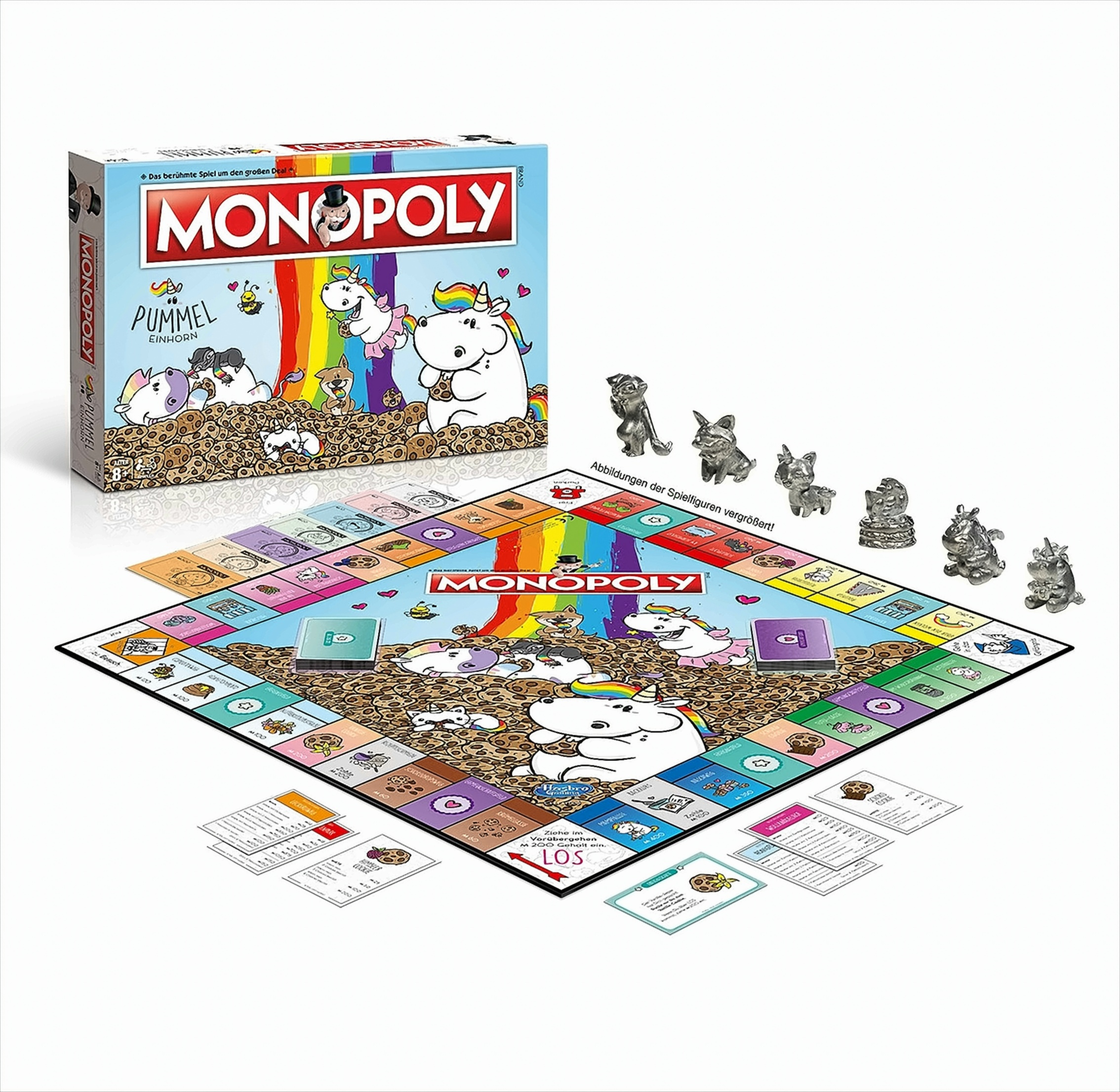 Monopoly Pummel Einhorn Brettspiel mit bunten Figuren, Karten und Spielbrett auf weißem Hintergrund.