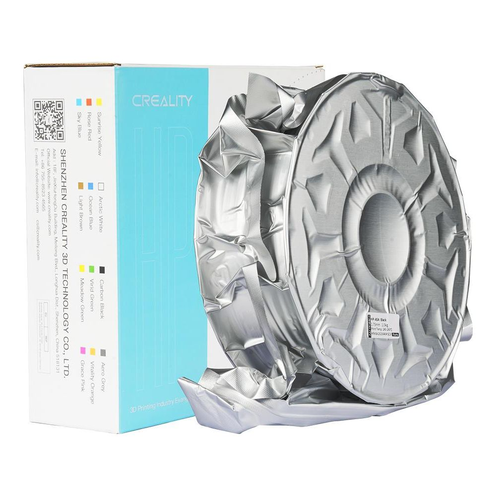 Bobina di filamento per stampante 3D Creality in una confezione argentata sigillata accanto alla scatola.