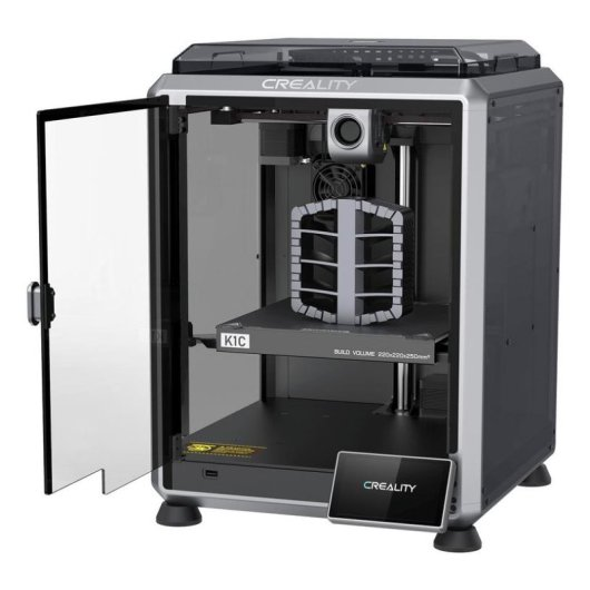 Stampante 3D Creality K1C con porta in vetro aperta e oggetto stampato sul piatto.
