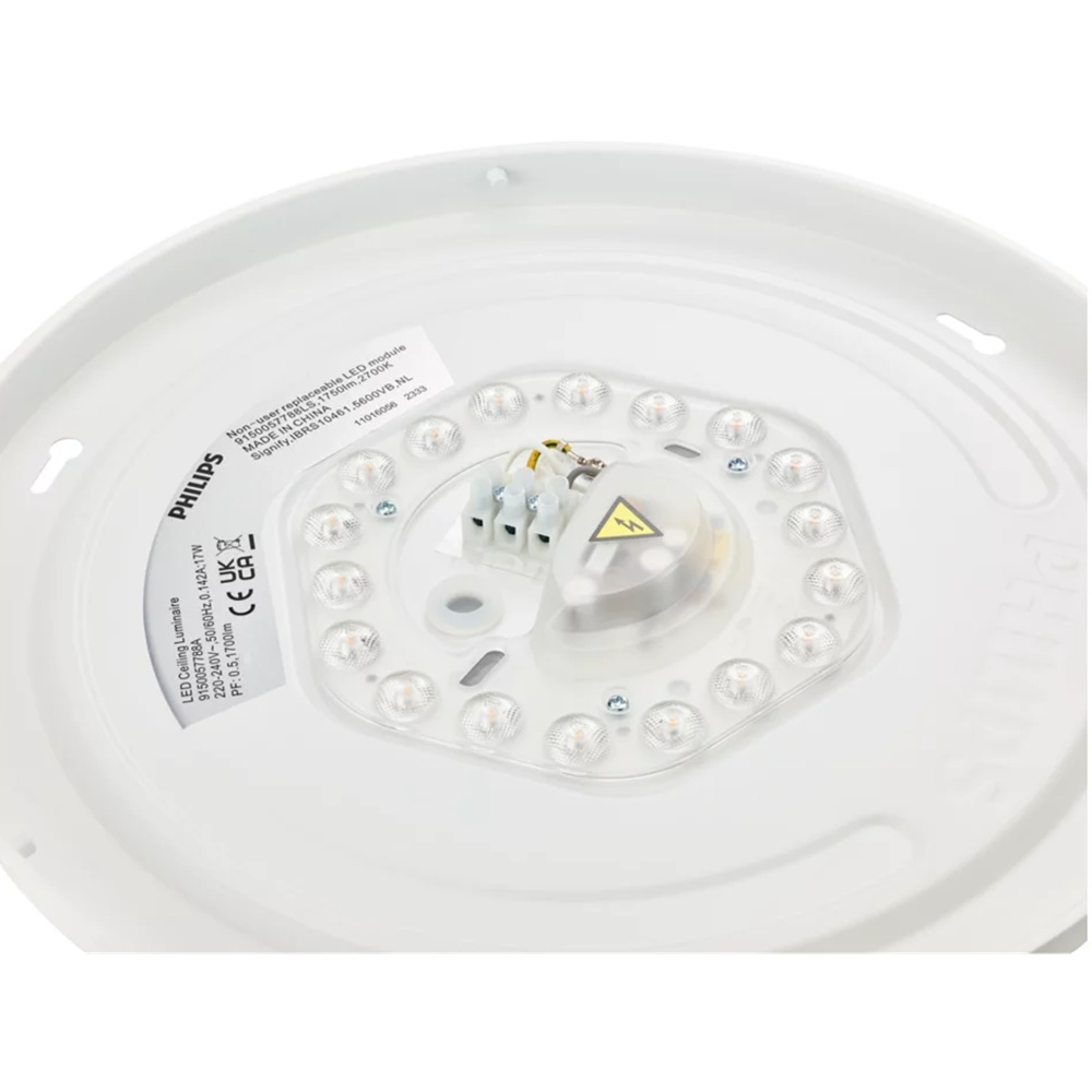Intérieur d'un plafonnier LED Philips rond montrant des LED en cercle et un bornier électrique.