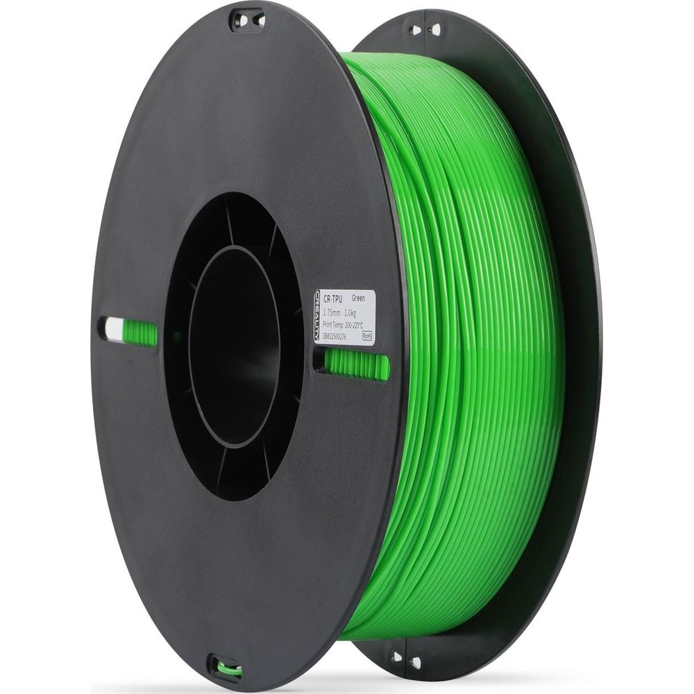 Una bobina di plastica nera di filamento verde per stampante 3D con etichetta, su sfondo bianco.