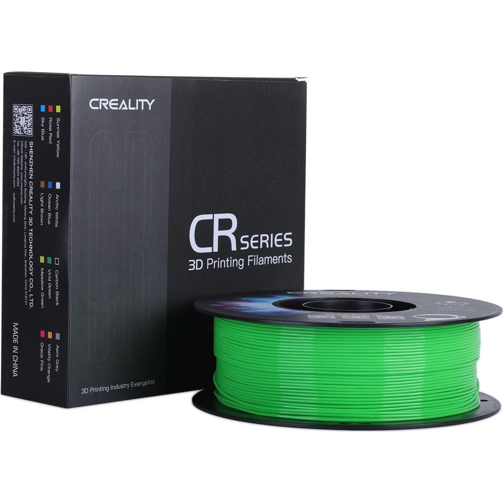 Una scatola di filamento per stampante 3D Creality CR Series accanto a una bobina verde.