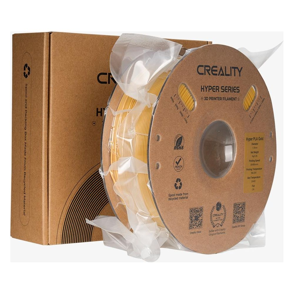 Filamento per stampante 3D Creality Hyper Series oro su bobina davanti alla sua scatola.