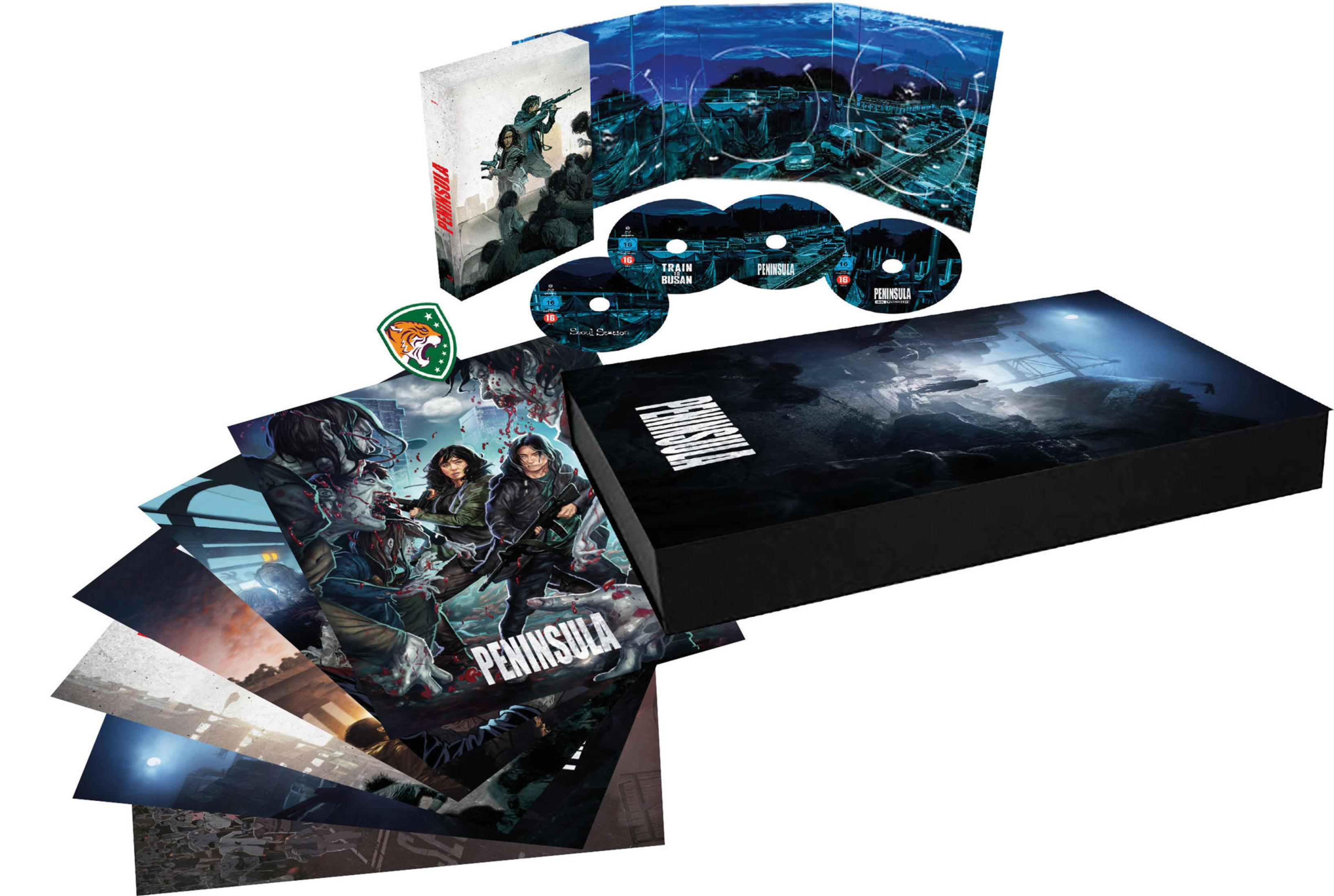Peninsula Blu-ray Box mit Hülle, Discs, Karten und Kunstdrucken auf weißem Hintergrund.