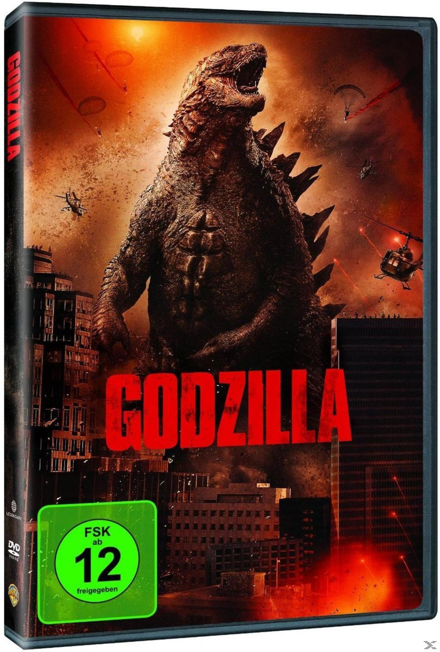 Godzilla überragt eine brennende Stadt mit Hubschraubern und Fallschirmspringern am rauchigen Himmel.