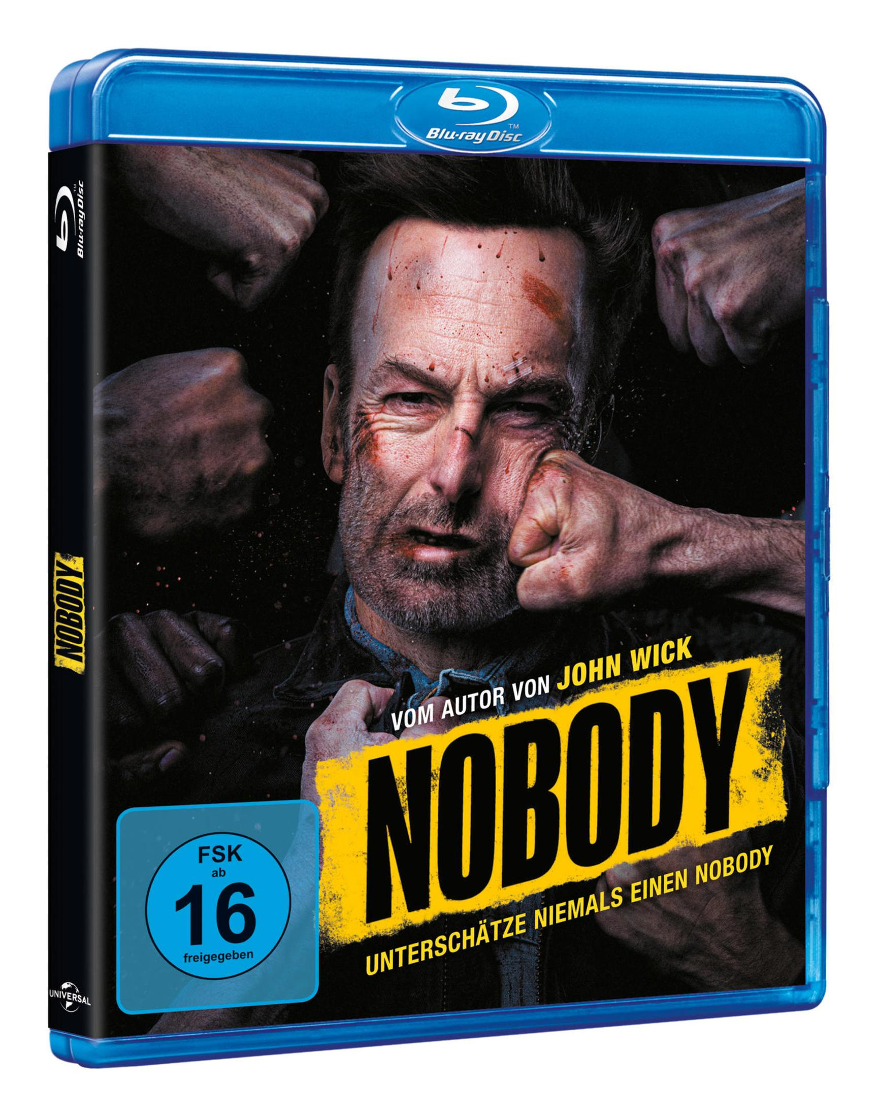 Blu-ray-Hülle des Films Nobody mit einem blutigen Mann im Zentrum, der ins Gesicht geschlagen wird.