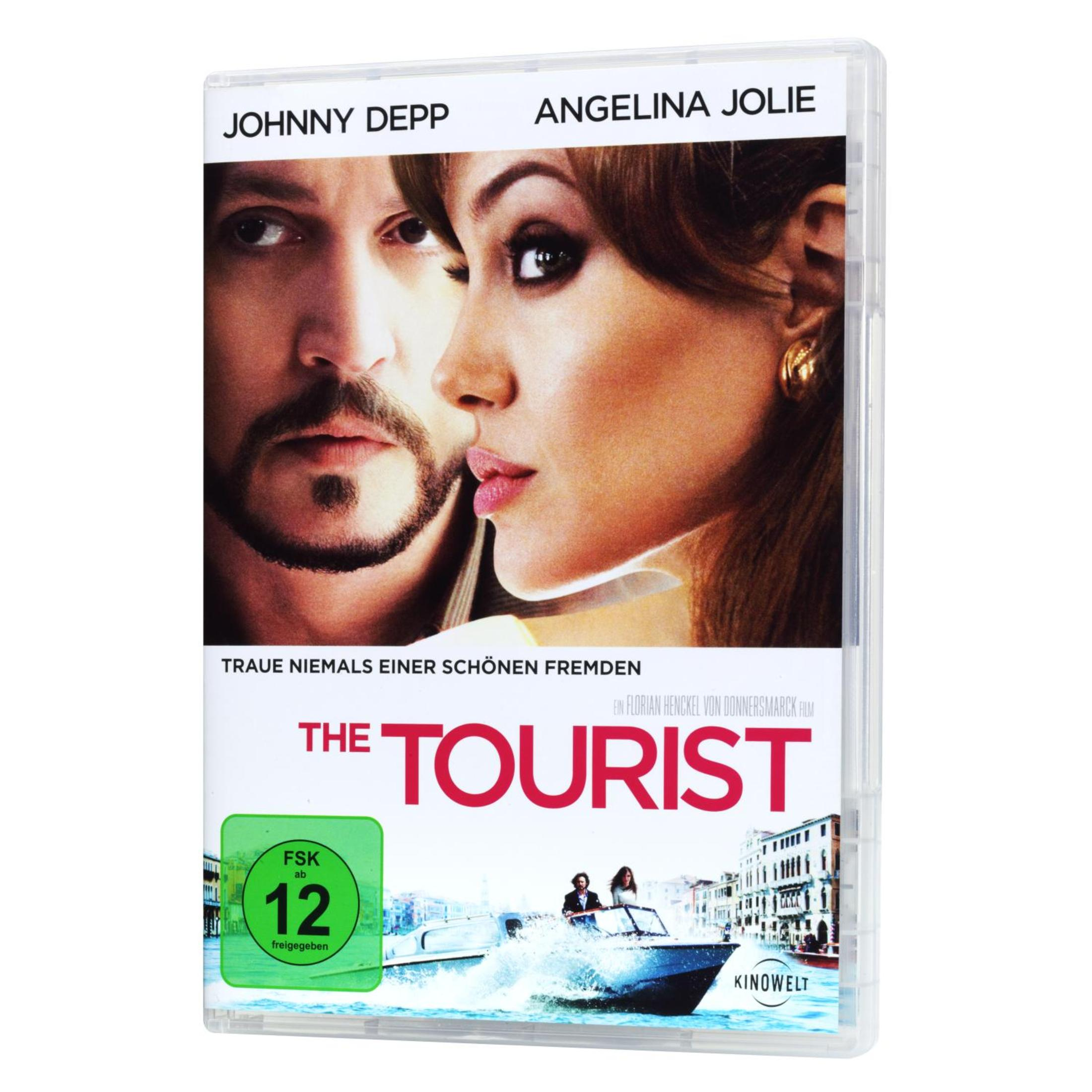 DVD-Cover von The Tourist mit Johnny Depp und Angelina Jolie, darunter ein Motorboot auf dem Wasser in Venedig.