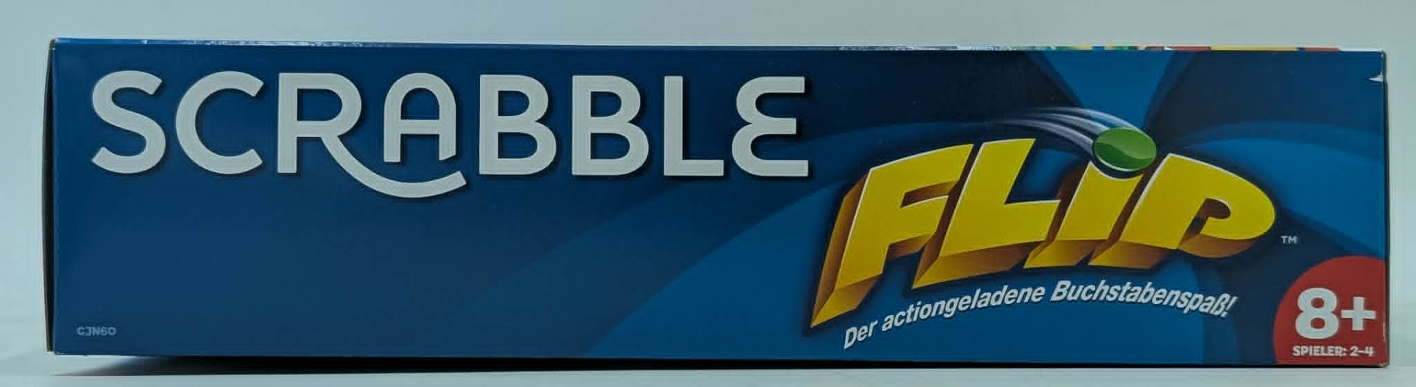 Blaue Scrabble Flip Schachtel mit gelbem FLIP-Schriftzug.