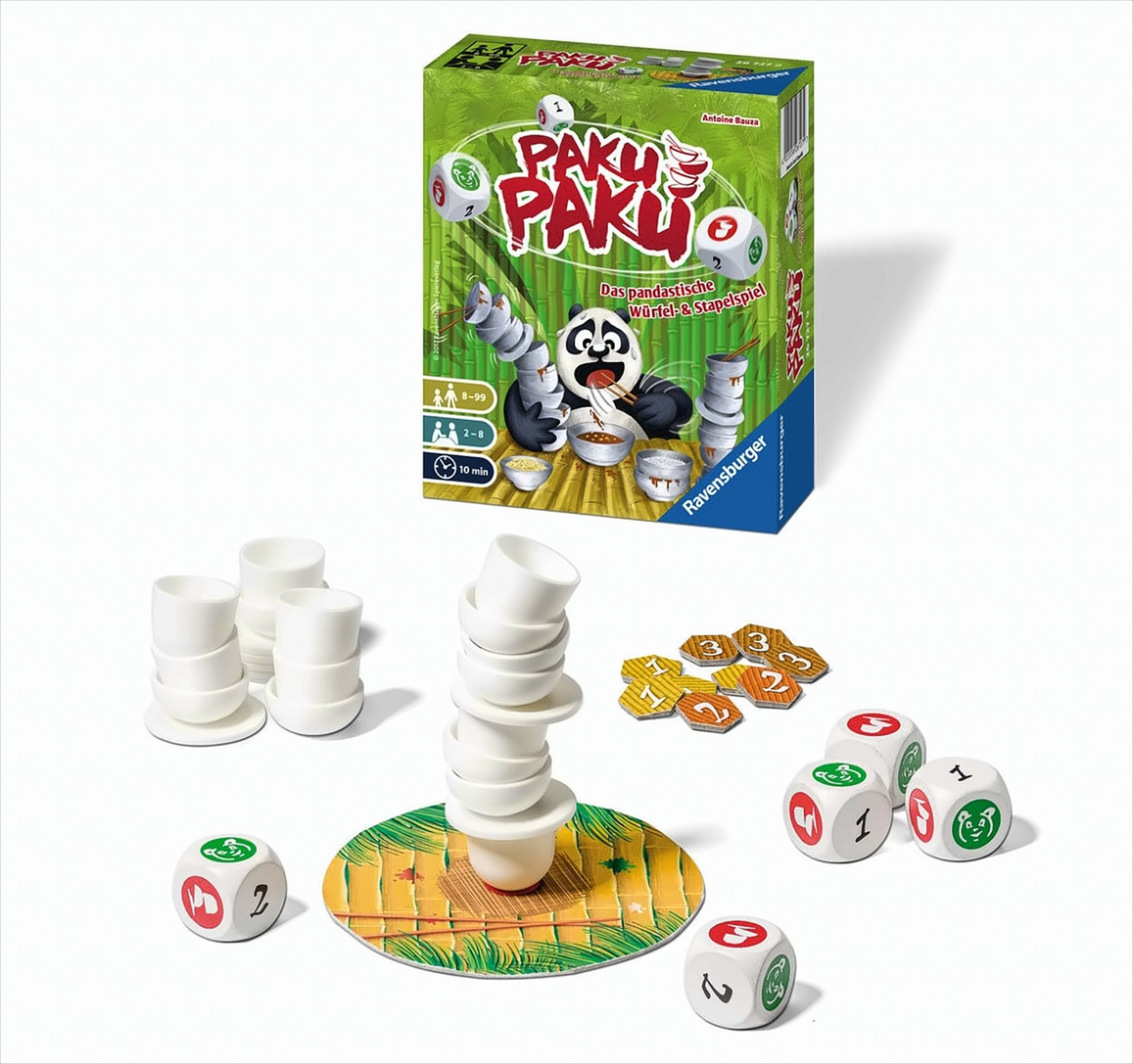 Paku Paku Brettspiel mit gestapelten weißen Schalen, Würfeln und Spielteilen vor der Schachtel.