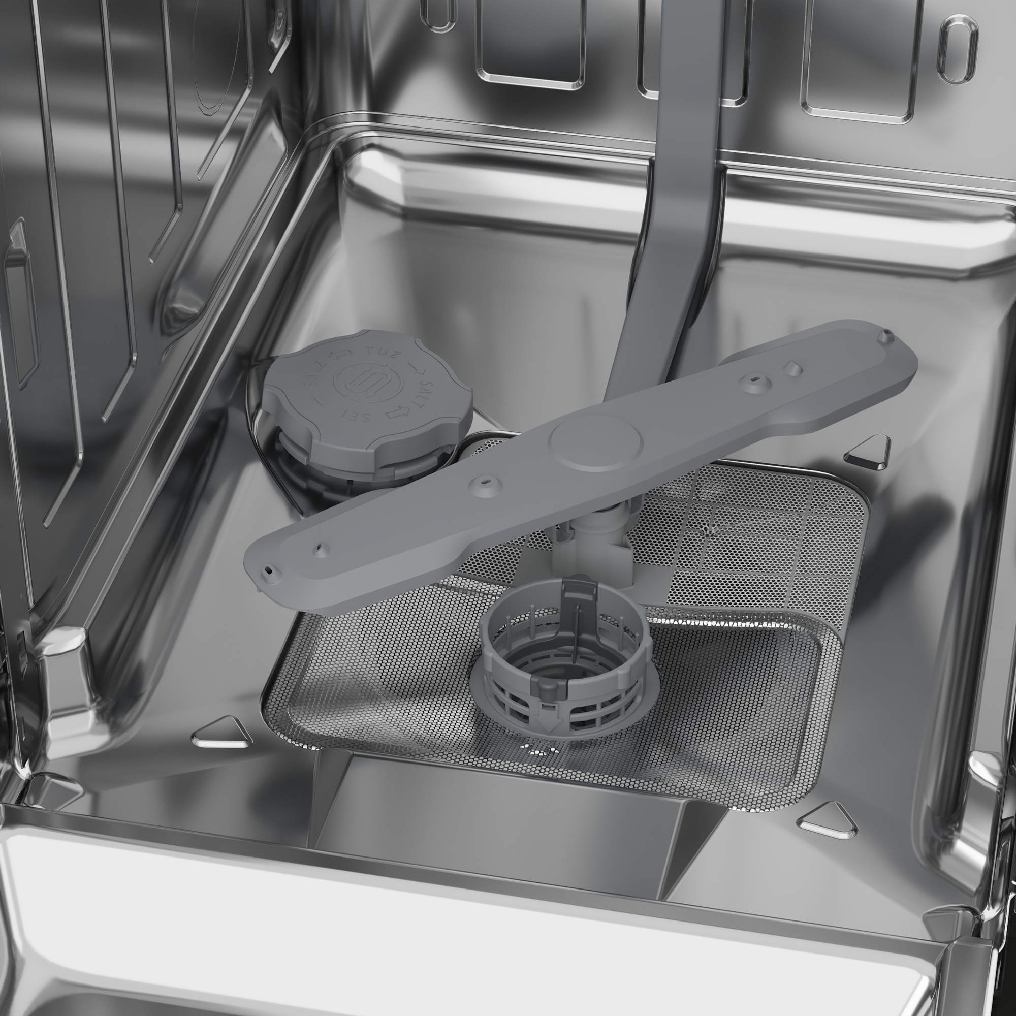 Interno di una lavastoviglie in acciaio inox con braccio irroratore grigio, filtro e tappo sale.