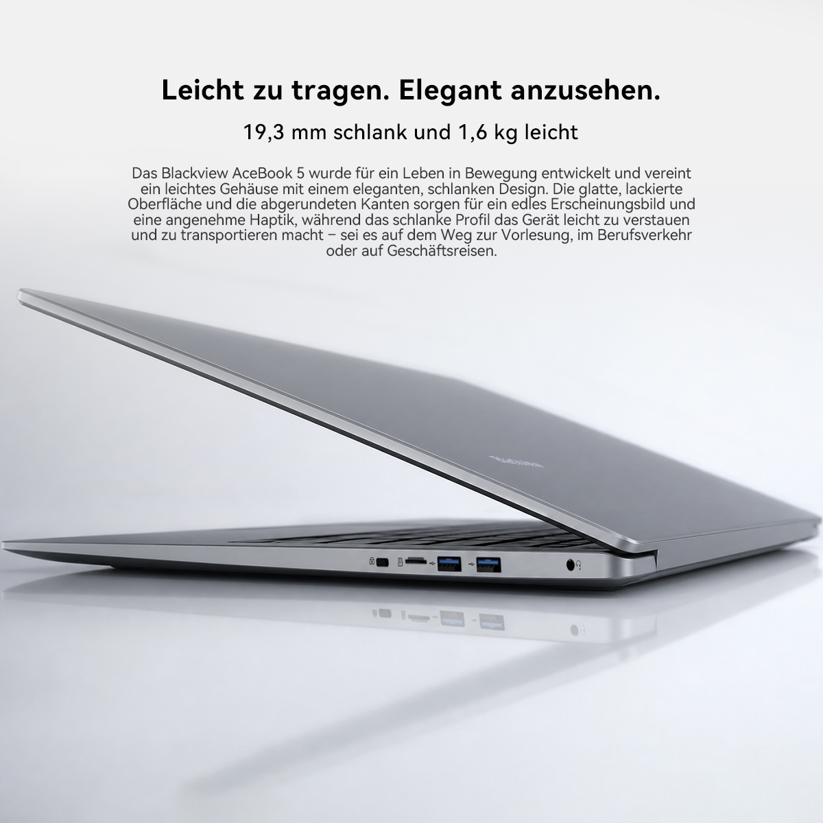 Schlanker grauer Laptop im Profil mit Text auf Deutsch und weißem Hintergrund.