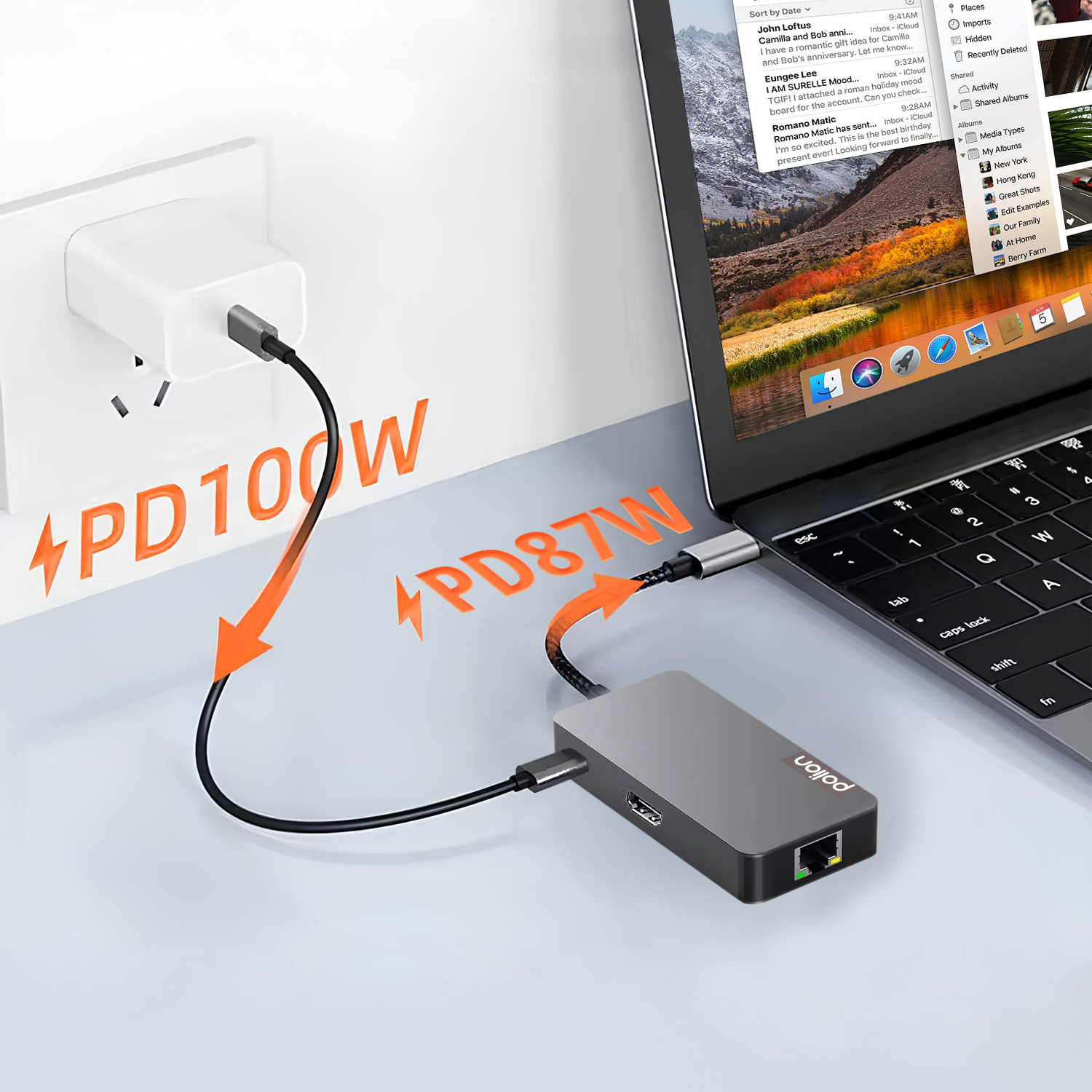 Laptop połączony z hubem USB-C i ładowarką ścienną, z pomarańczowym tekstem PD100W i PD87W.