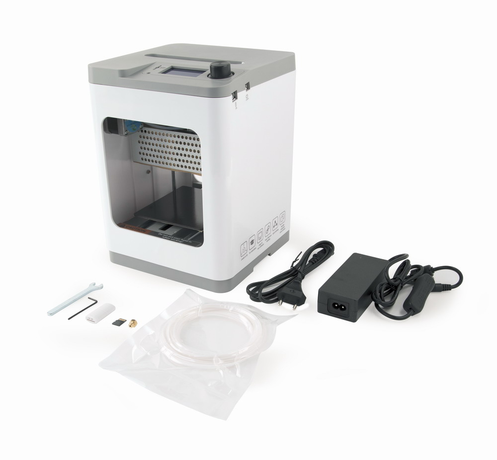 Stampante 3D compatta bianca e grigia con alimentatore, cavi, strumenti e accessori.