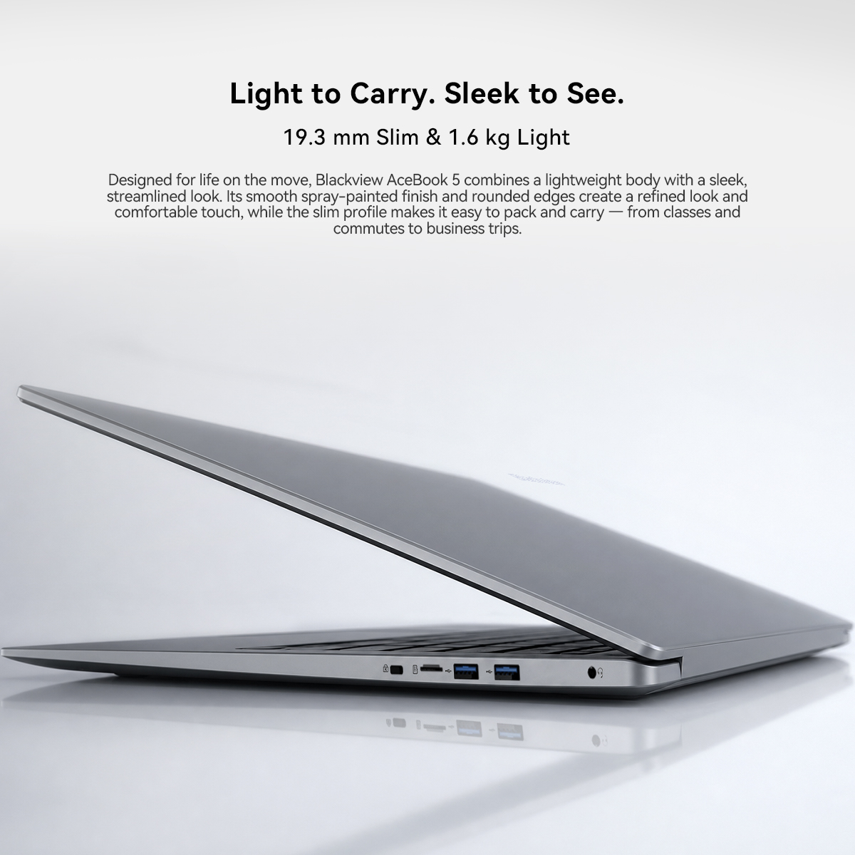 A side view of a silver laptop with text above.