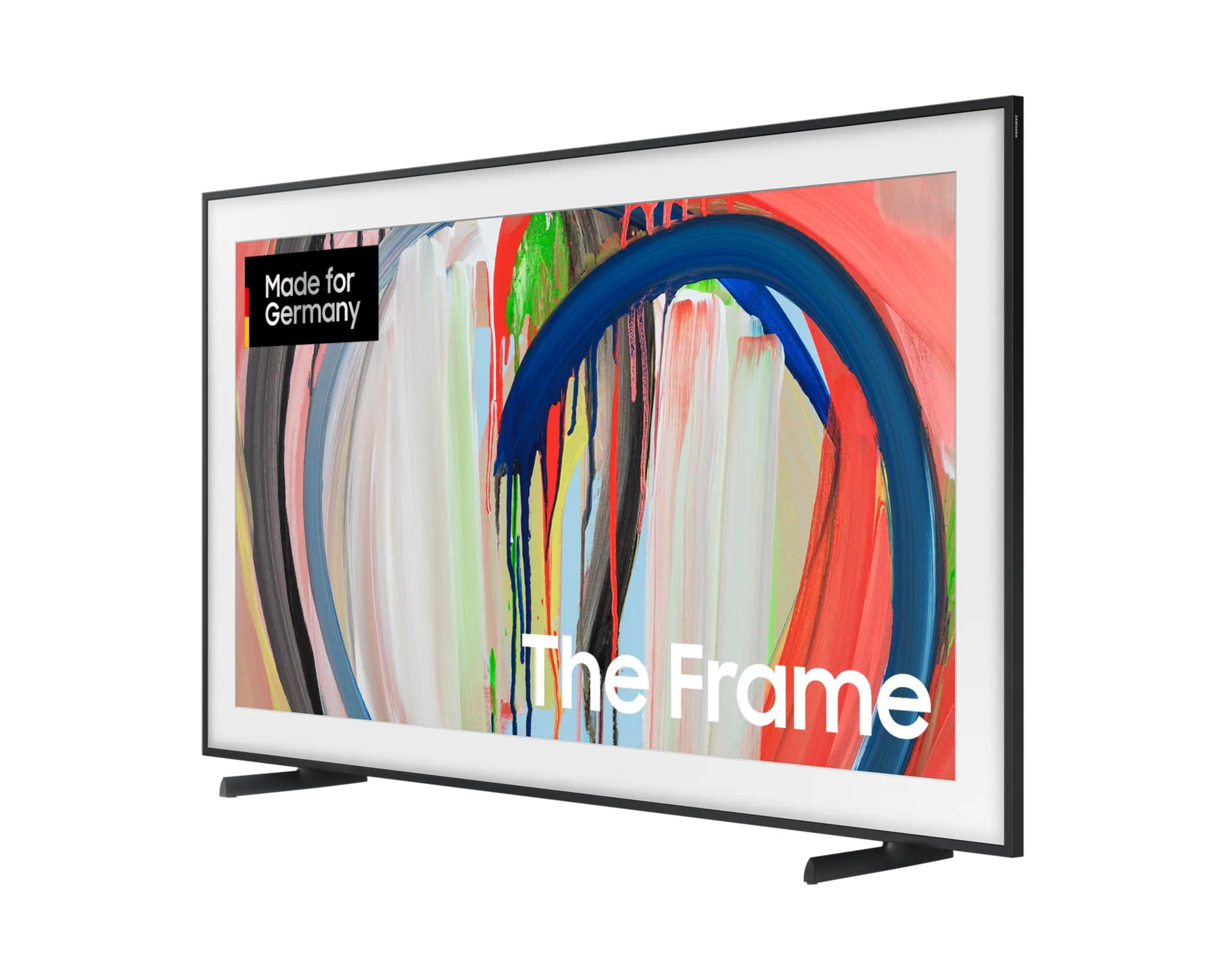 Samsung The Frame Fernseher mit schwarzem Rahmen und buntem Kunstwerk auf dem Bildschirm auf weißem Hintergrund.