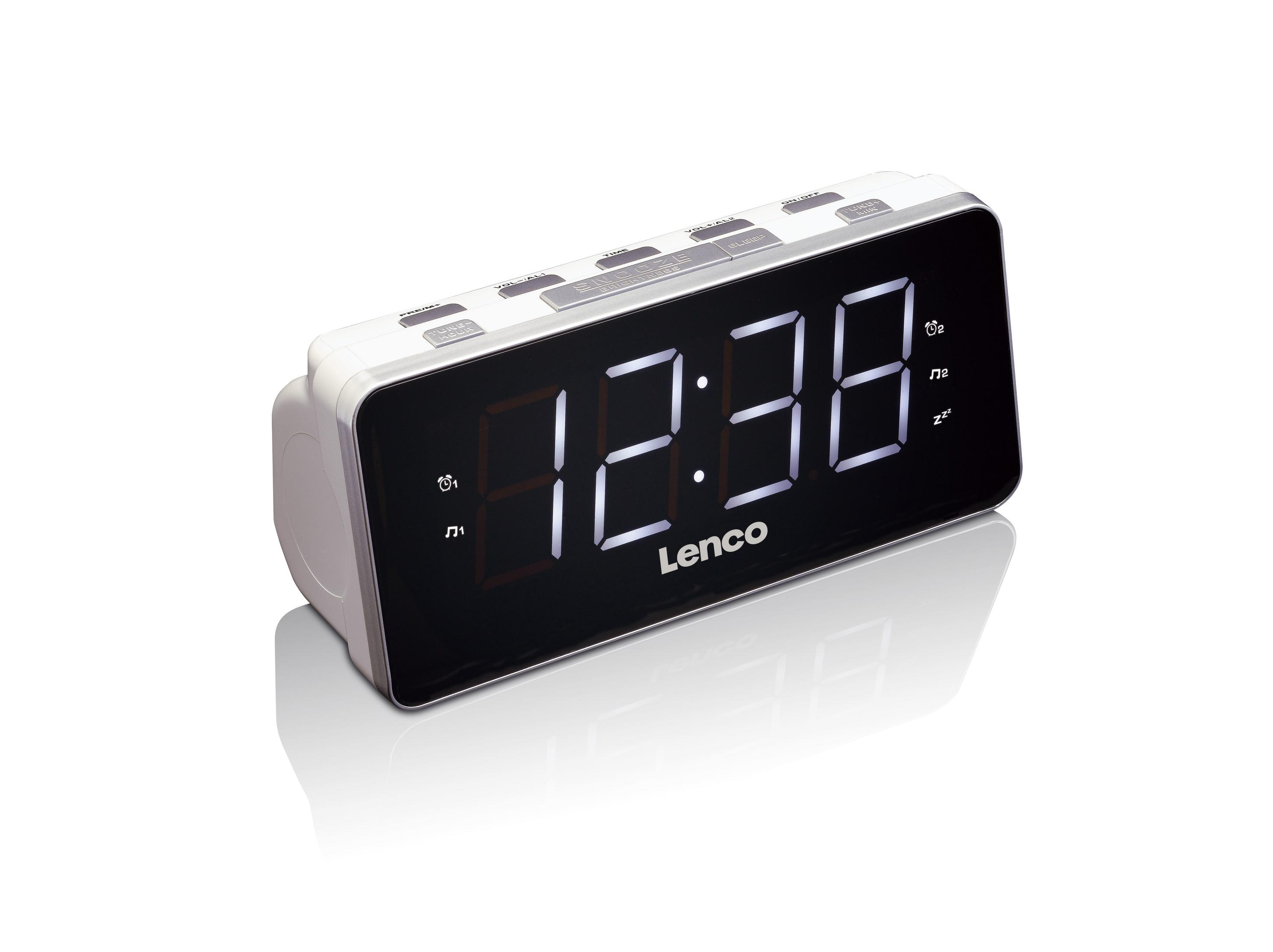 Una radiosveglia digitale Lenco bianca con display a LED che mostra 12:38 su sfondo bianco.