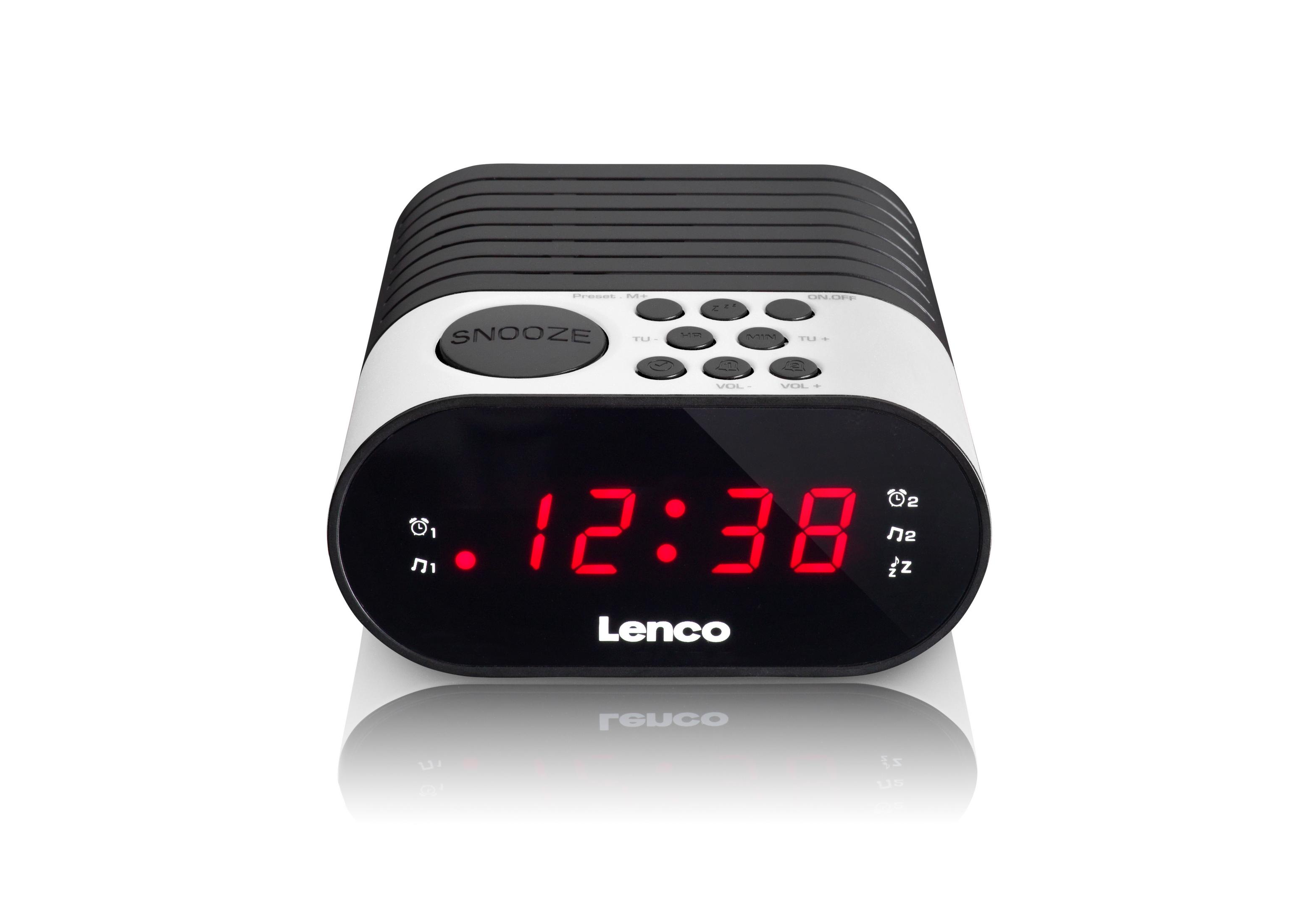 Una radiosveglia digitale Lenco bianco e nero con display LED rosso che mostra 12:38.