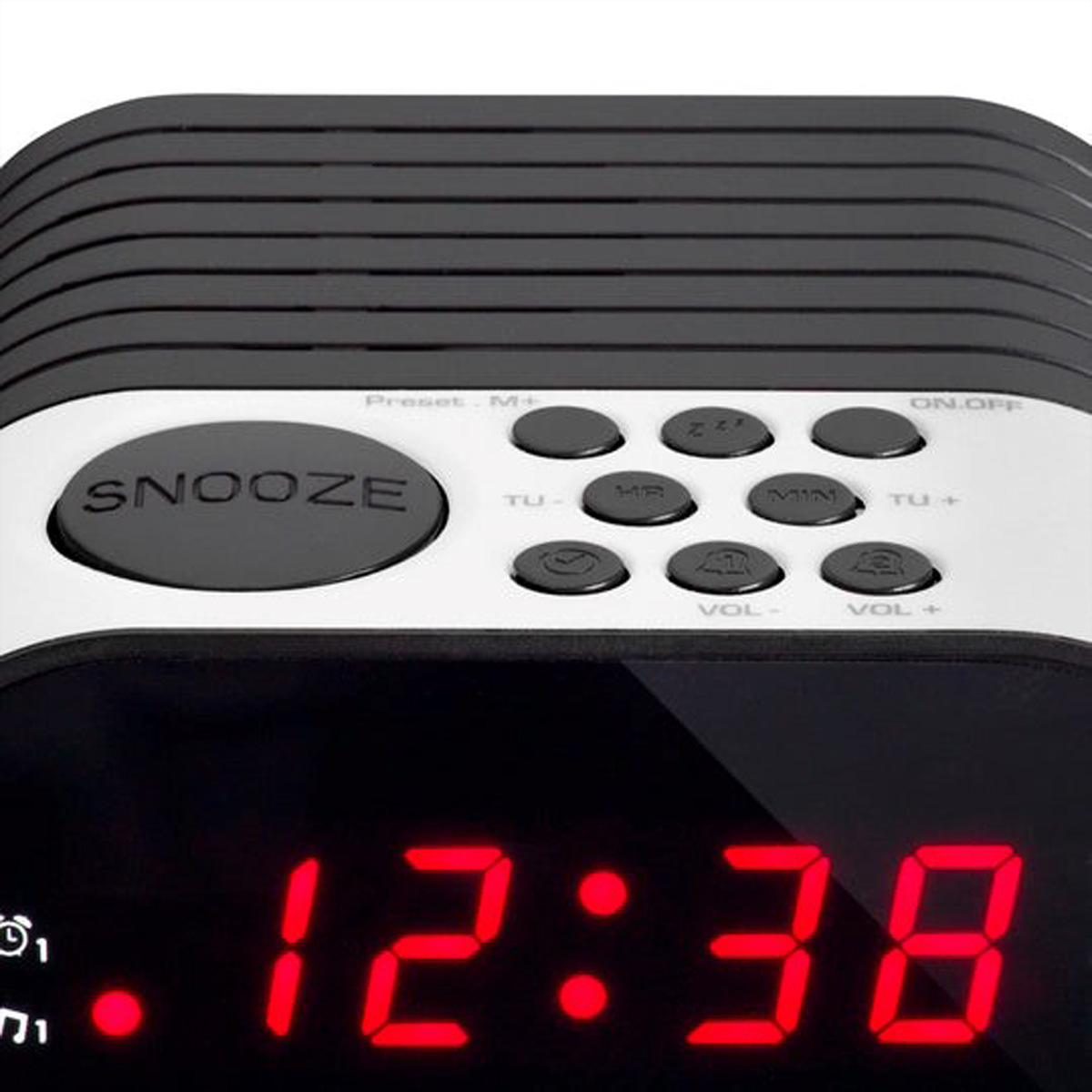 Orologio digitale nero con pannello superiore argentato e pulsanti, mostra l'ora LED rossa 12:38.