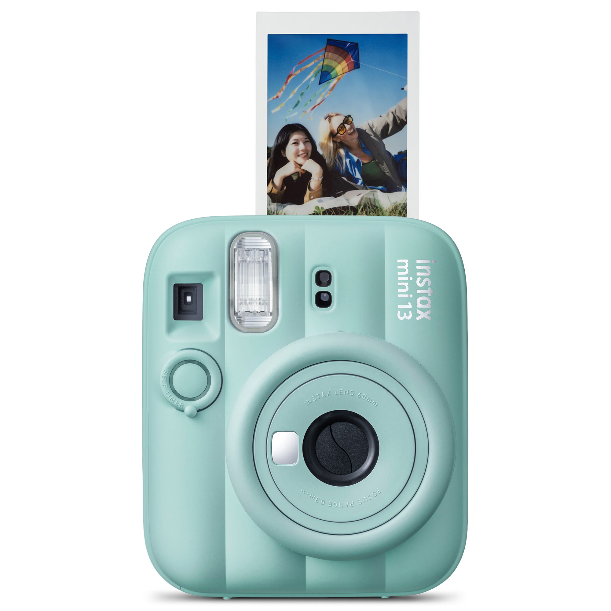 Uçurtma uçuran iki kadının basılı bir fotoğrafının yer aldığı pastel yeşil renkli bir Instax Mini anlık kamerası.