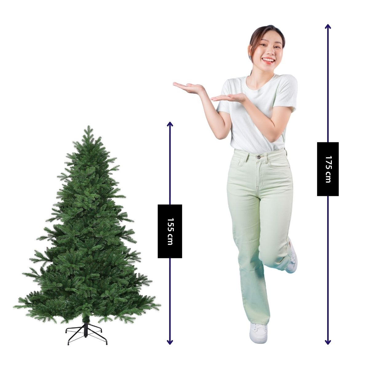 A woman in a white shirt gestures toward a 155 cm artificial Christmas tree against a white background.