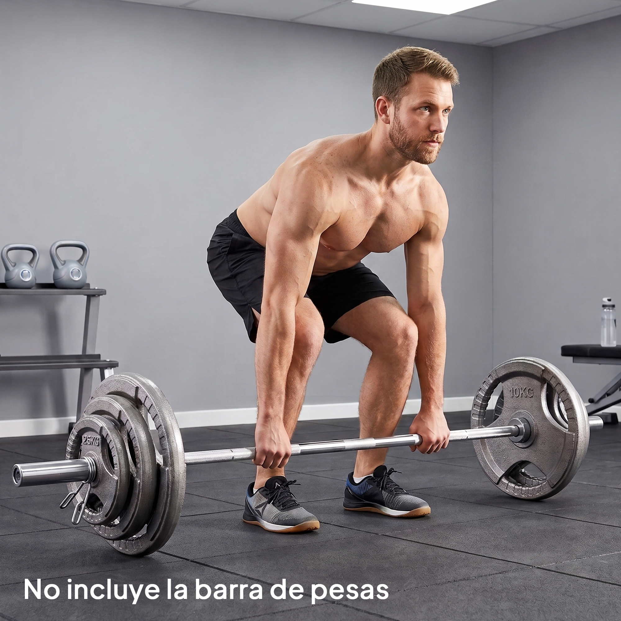 Un hombre musculoso se prepara para levantar una barra pesada con discos en un gimnasio.