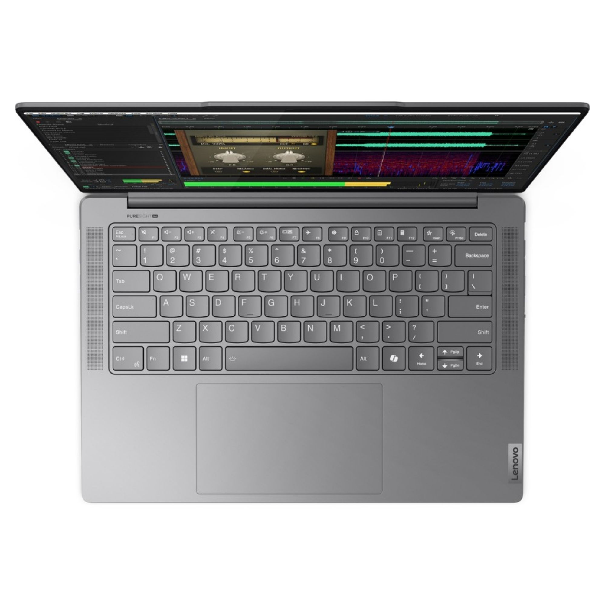 Ekranında ses düzenleme yazılımı olan açık gri bir Lenovo dizüstü bilgisayarın üstten görünümü.
