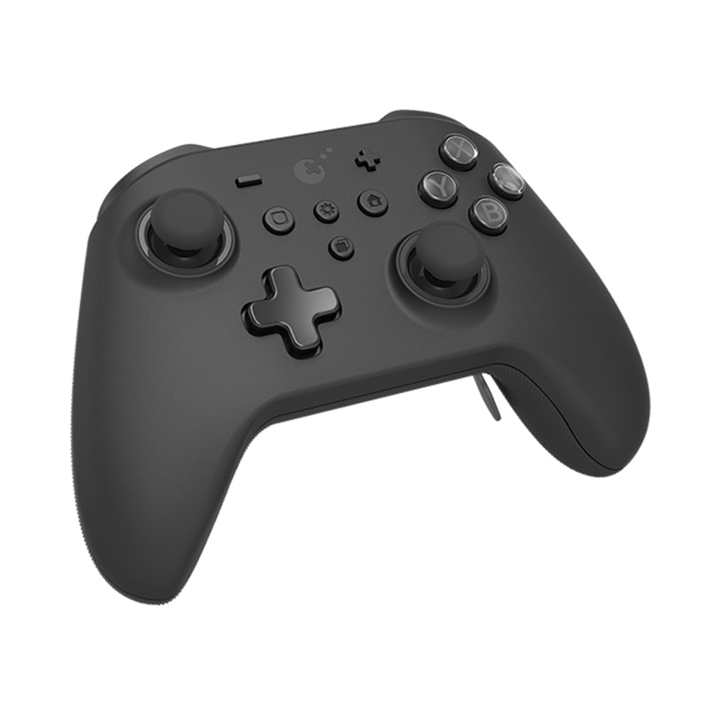 Beyaz arka plan üzerinde joysticks, düğmeler ve bir D-pad içeren siyah kablosuz video oyun kontrolcüsü.