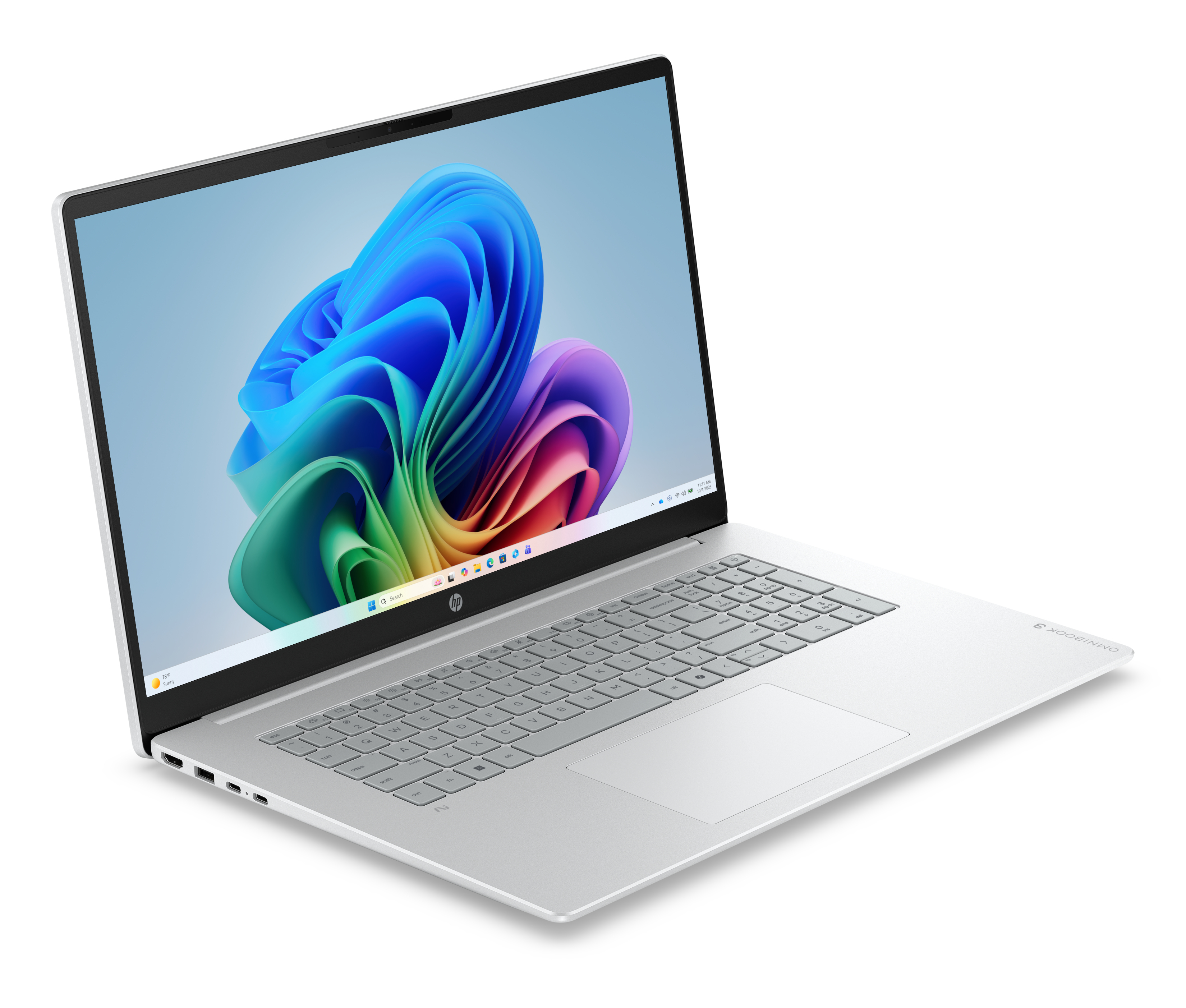 Laptop argentato con tastiera bianca e schermo che mostra un'onda astratta blu e colorata.