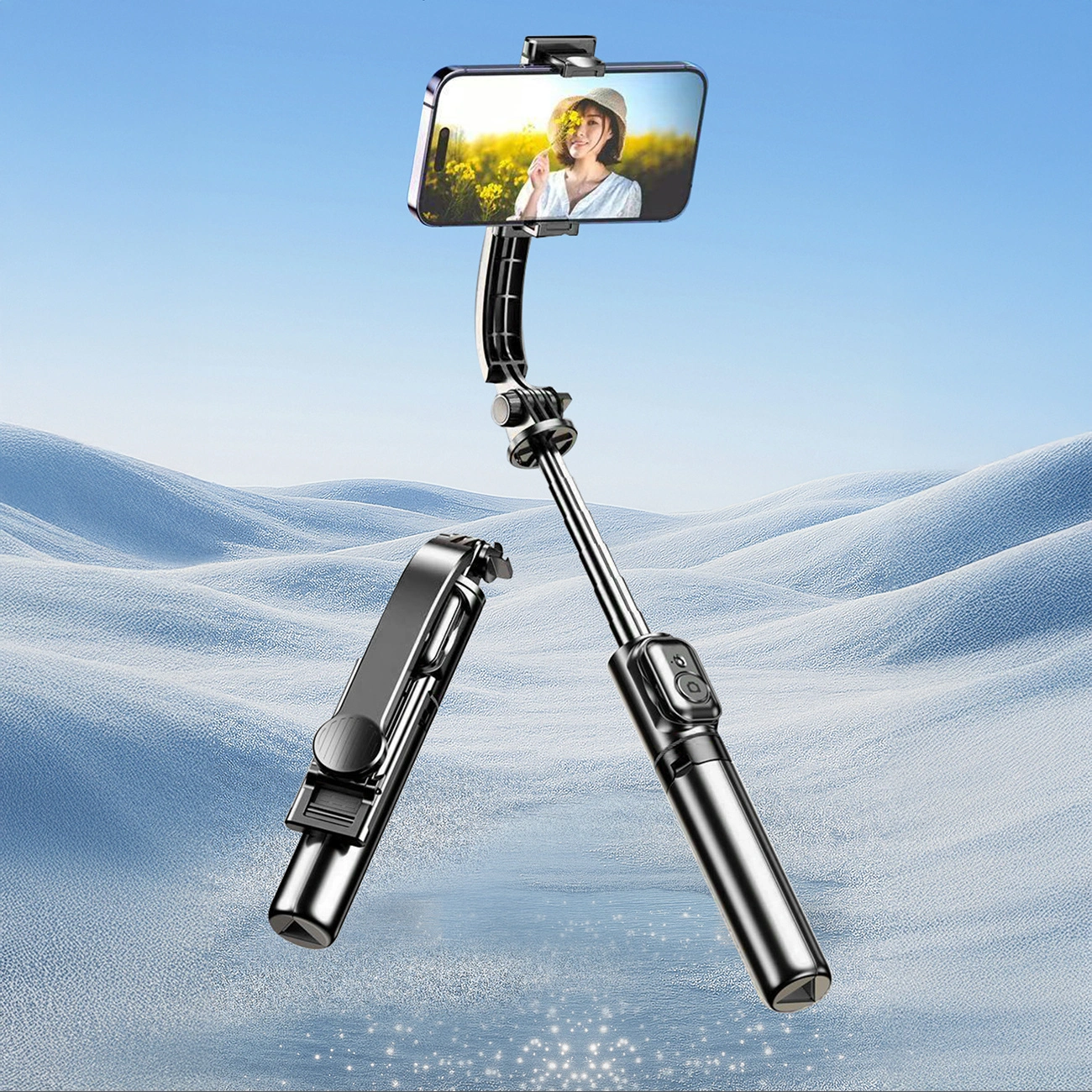 Un selfie stick nero con smartphone e gambe da treppiede su sfondo innevato.
