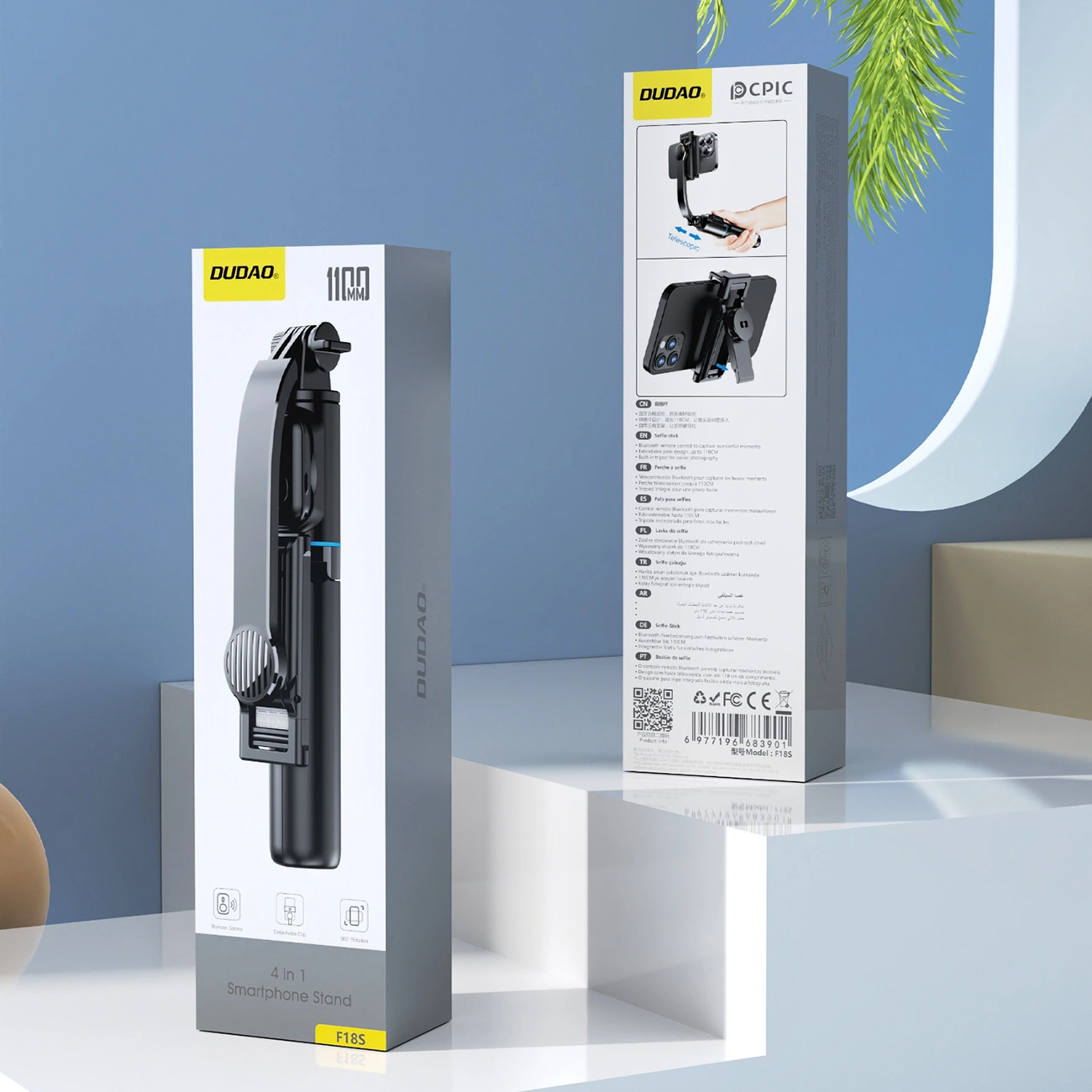 Due confezioni di prodotti per un supporto per smartphone Dudao F18S su una superficie bianca con sfondo blu.