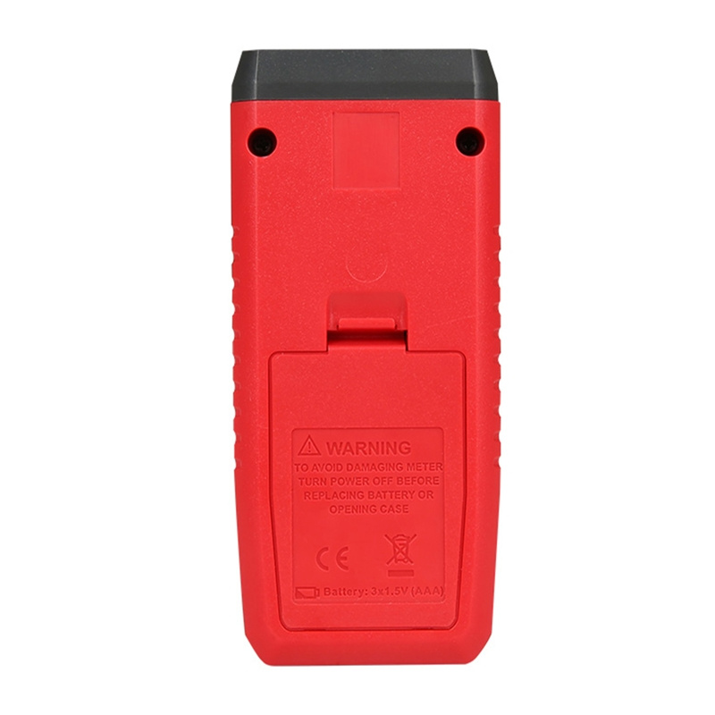 Vista posteriore di un misuratore rosso con vano batteria e avvertenze.