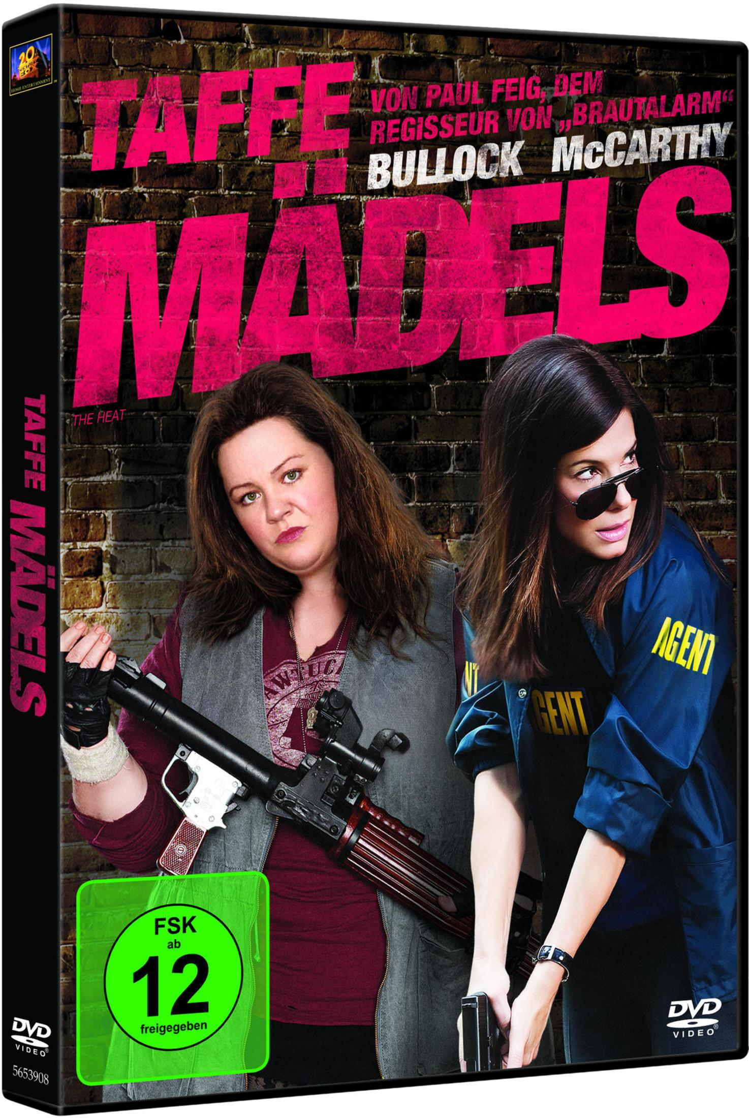 DVD-Cover von 'Taffe Mädels' mit Melissa McCarthy und Sandra Bullock mit Waffen vor einer Backsteinwand.