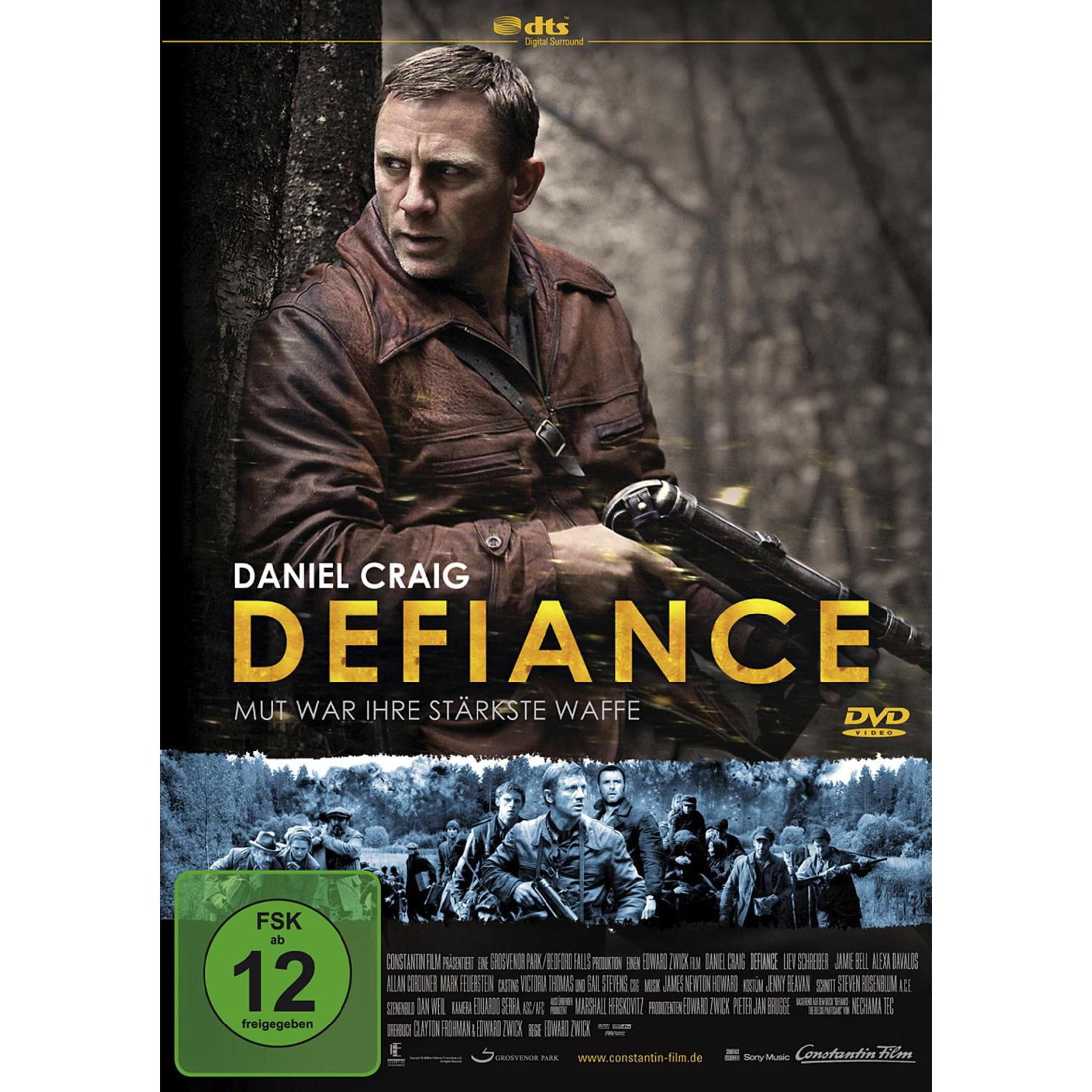 DVD-Cover des Films Defiance mit Daniel Craig in einer Jacke, der eine Waffe im Wald hält.