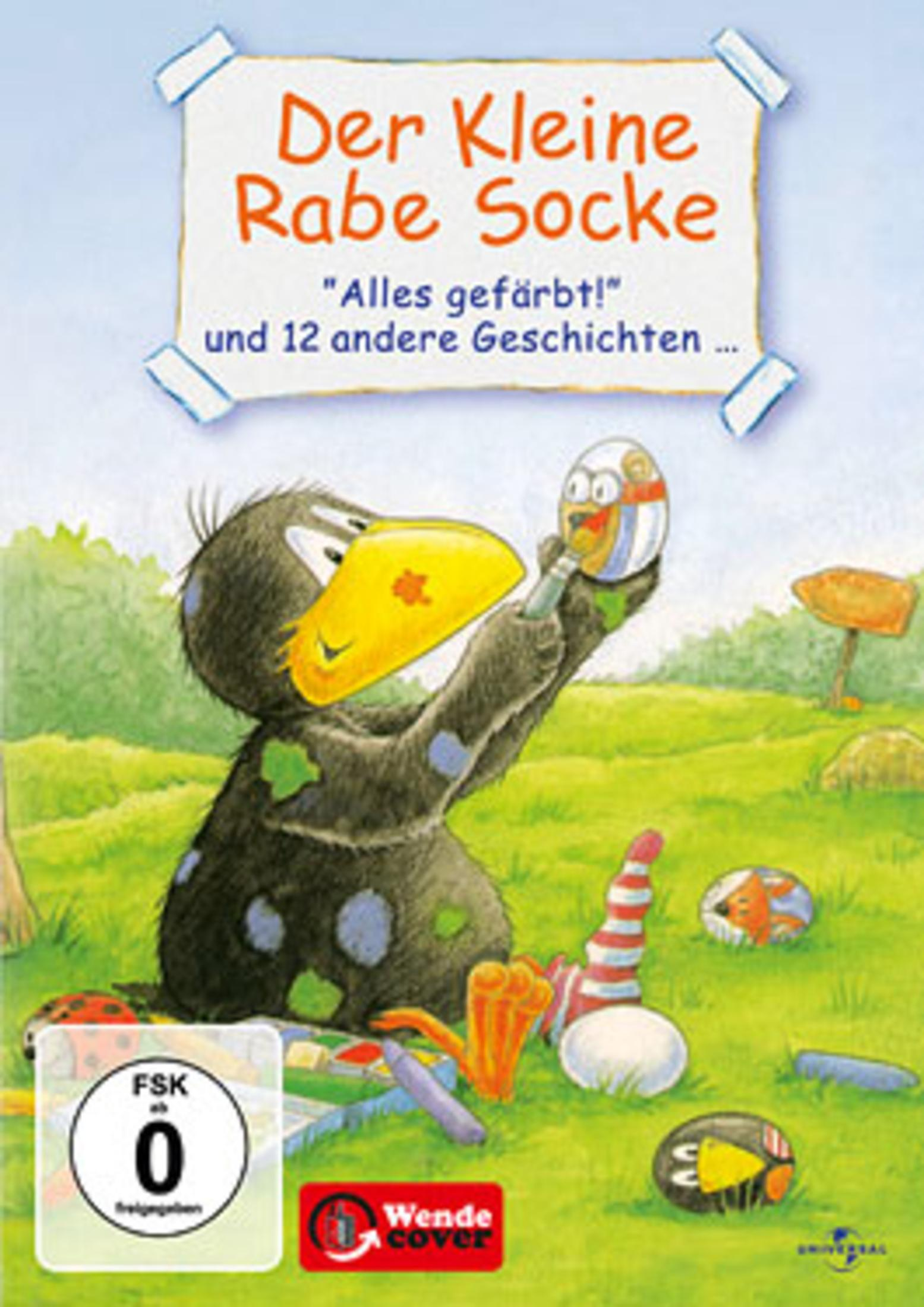 DVD-Cover von Der Kleine Rabe Socke: Ein kleiner Rabe malt ein buntes Ei auf einer Wiese.