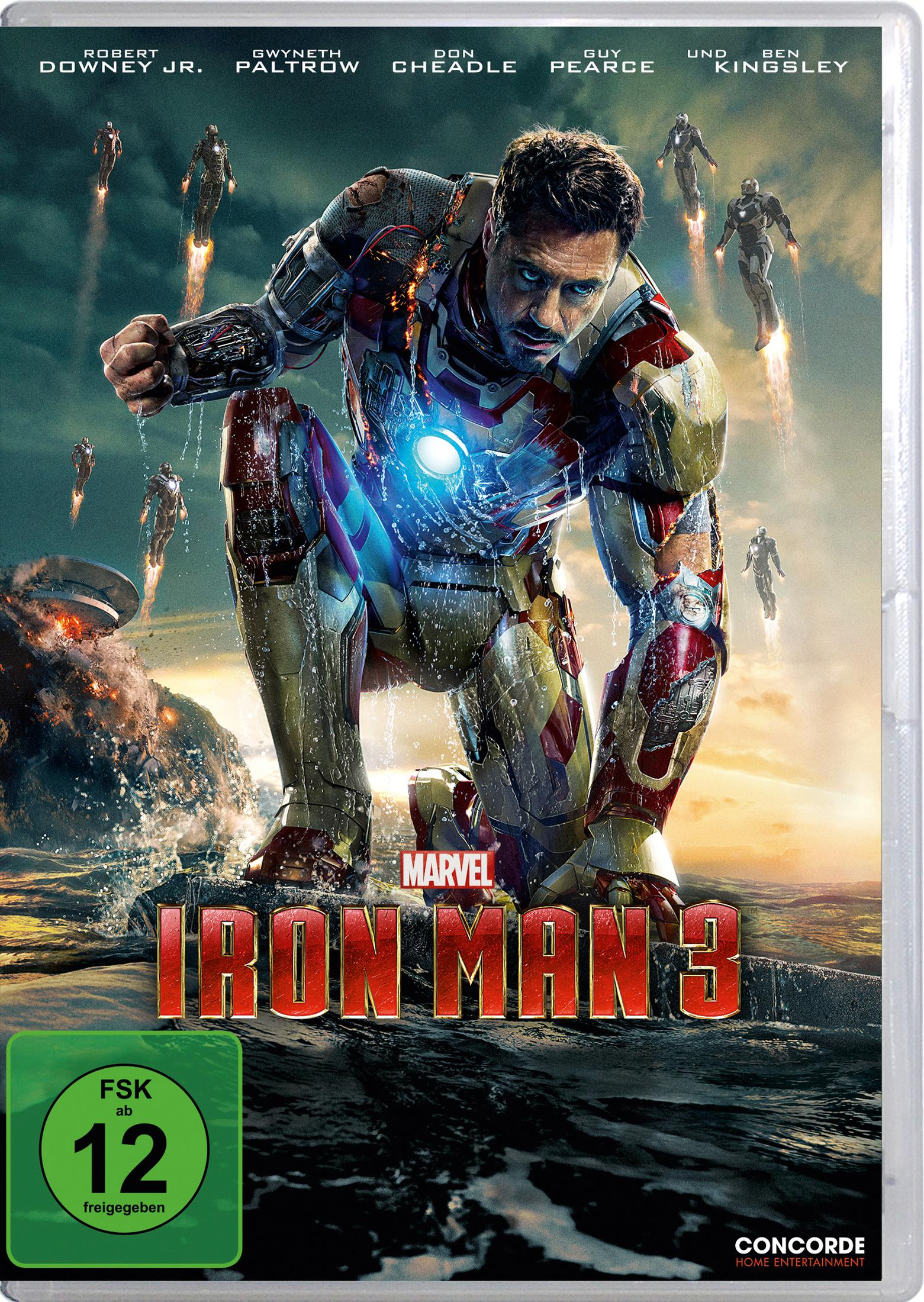 Iron Man kniet im Anzug vor rauer Kulisse, während andere Rüstungen fliegen.