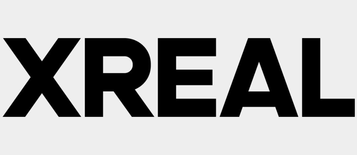 Logo XREAL nero su sfondo chiaro.