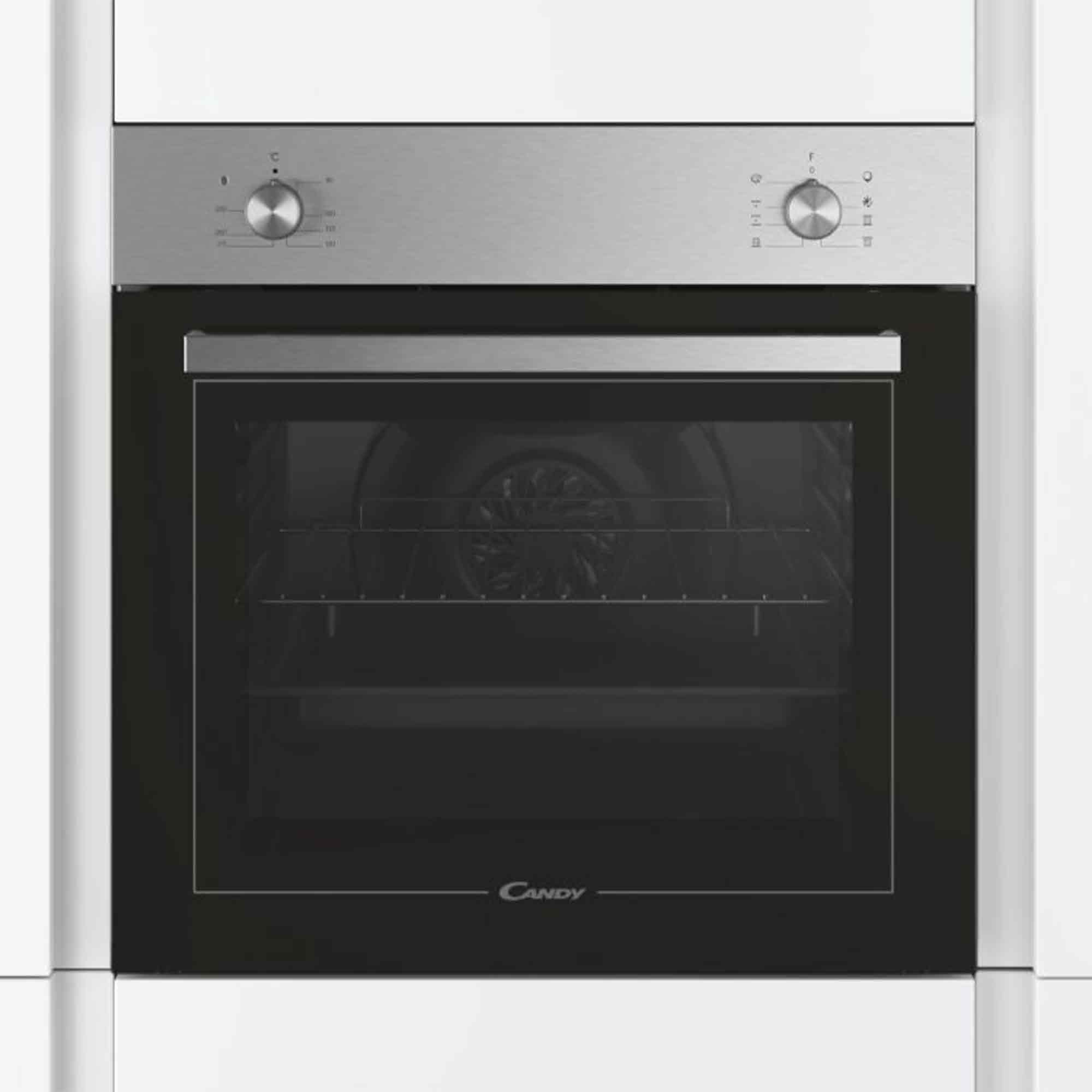 Edelstahl-Backofen von Candy mit schwarzem Glas und zwei Drehknöpfen in weißer Küchenwand.