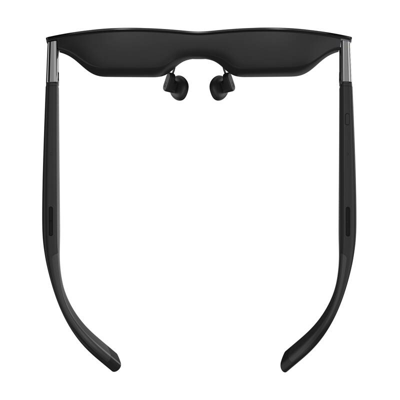 Un paio di eleganti occhiali intelligenti neri visti dall'alto su sfondo bianco.