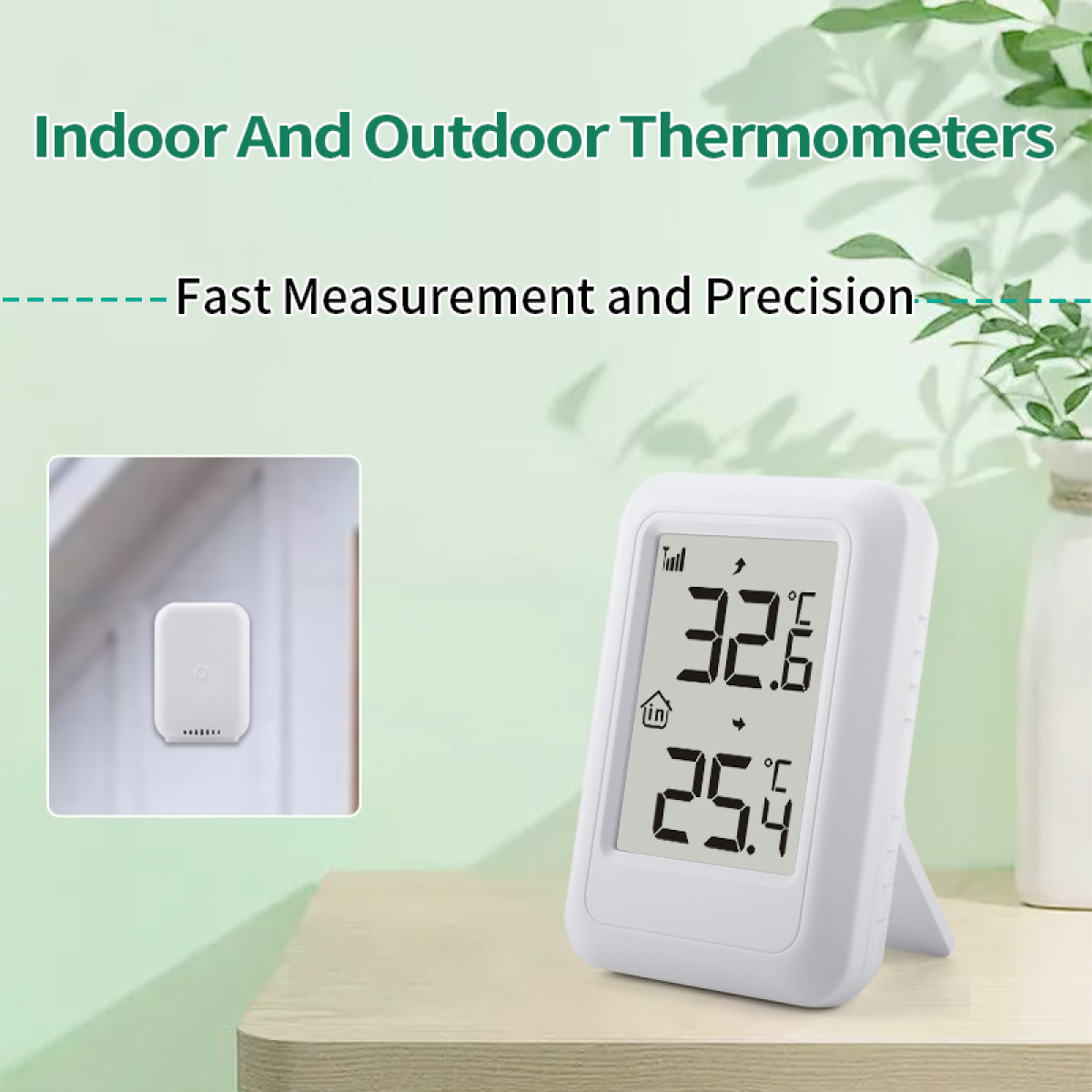 Ein weißes digitales Thermometer auf einem Holztisch vor grünem Hintergrund, mit einem kleineren Sensorbild.