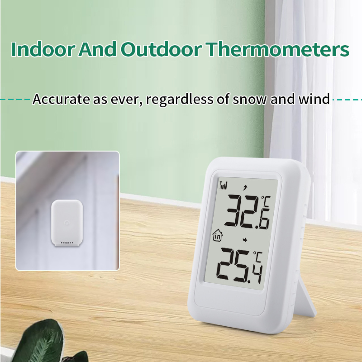 Weißes Innen- und Außenthermometer auf Holztisch mit Wand-Sensor im Inlay.